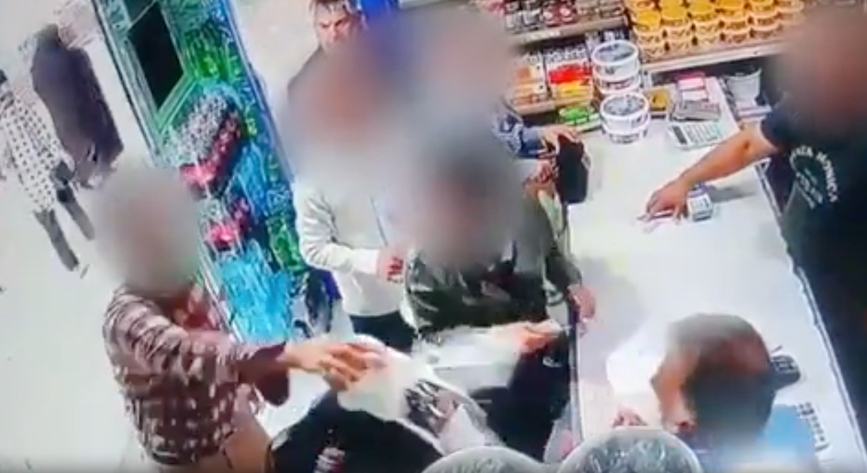 Moment man attacks women with yoghurt for not covering hair