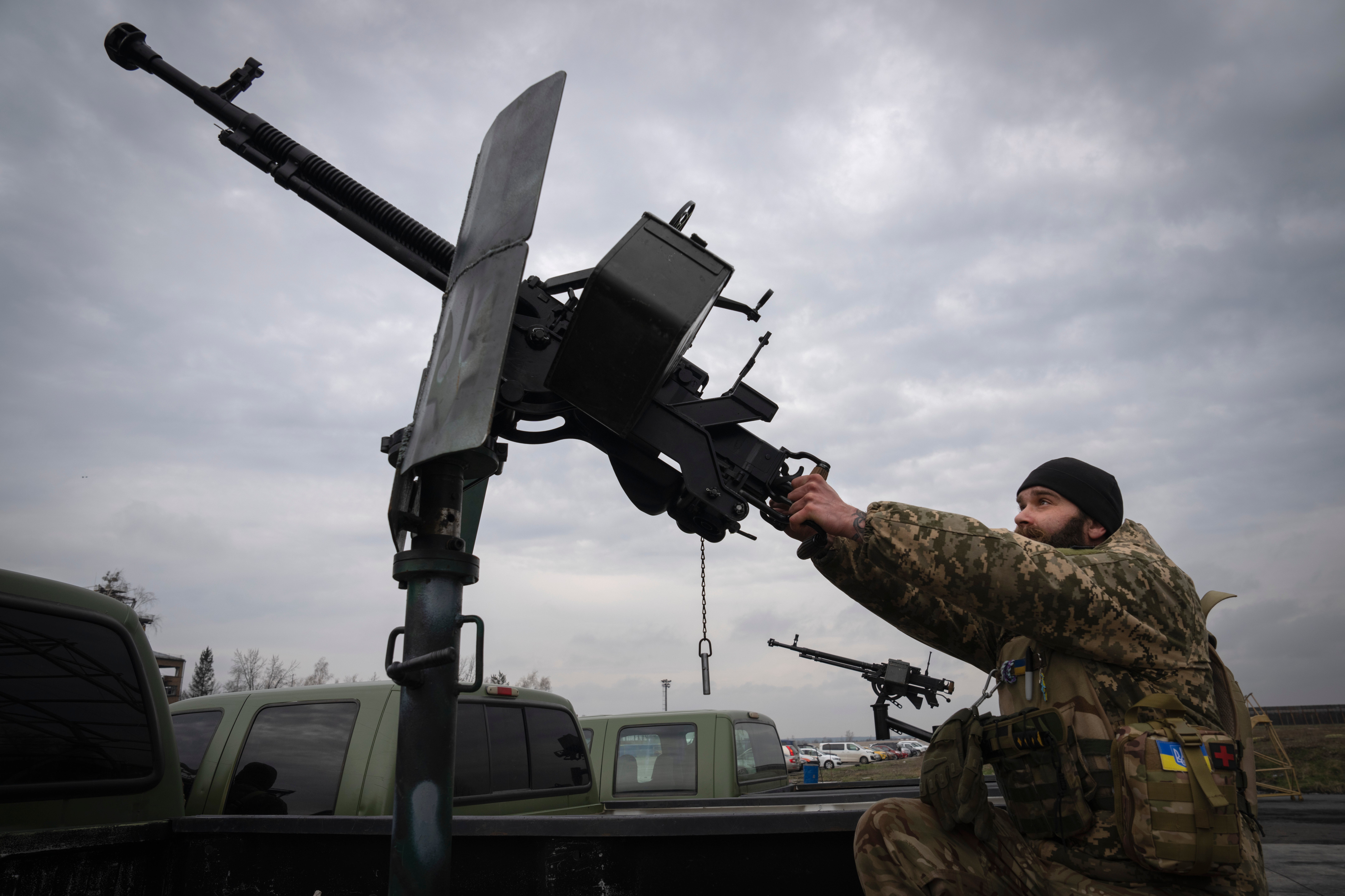 A Ukrainian soldier with a mobile air defence unit watches the skies at the Antonov airport in Hostomel on the outskirts of Kyiv