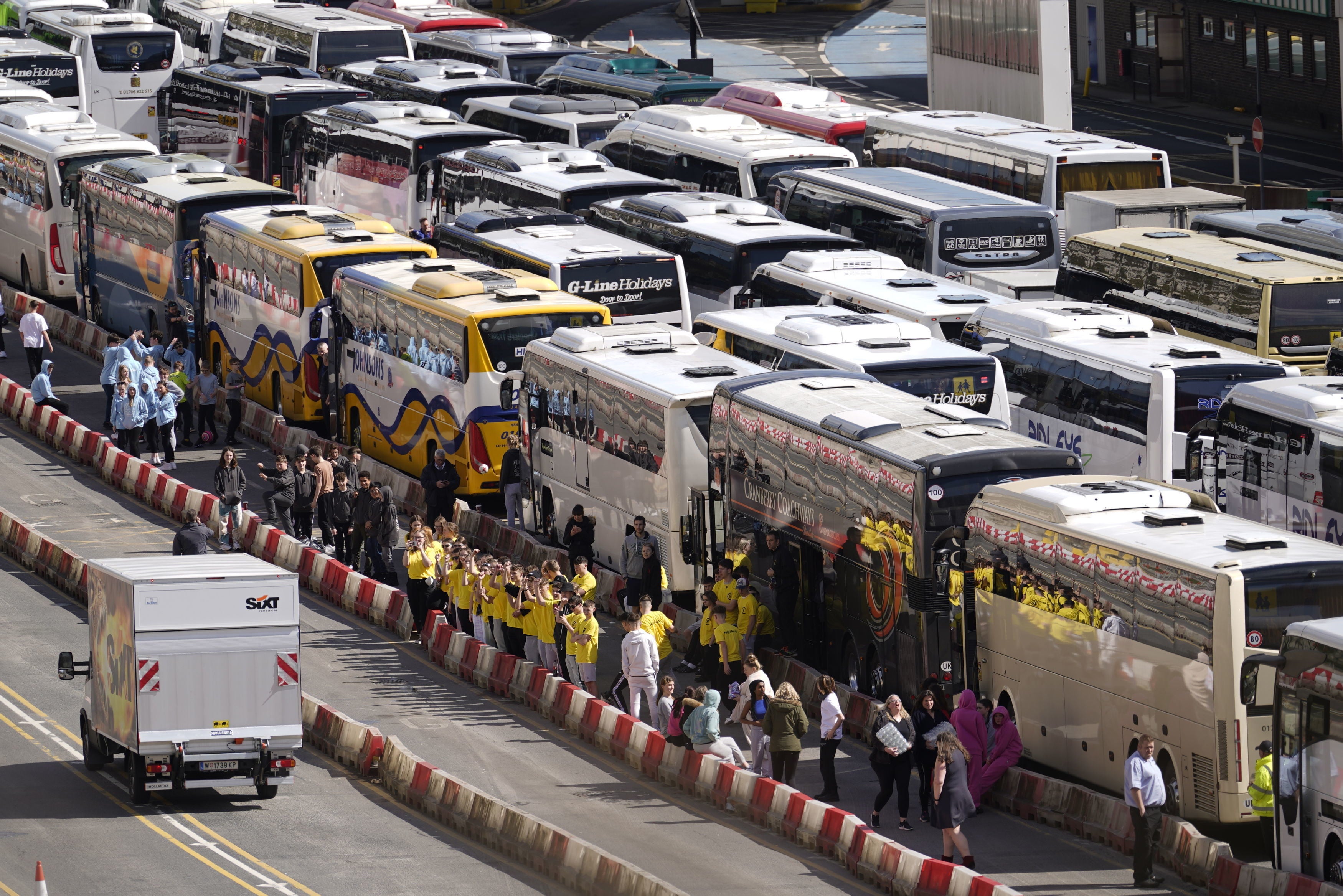 Coaches wait to enter the Port of Dover in Kent after extra sailings were run overnight to try and clear the backlog