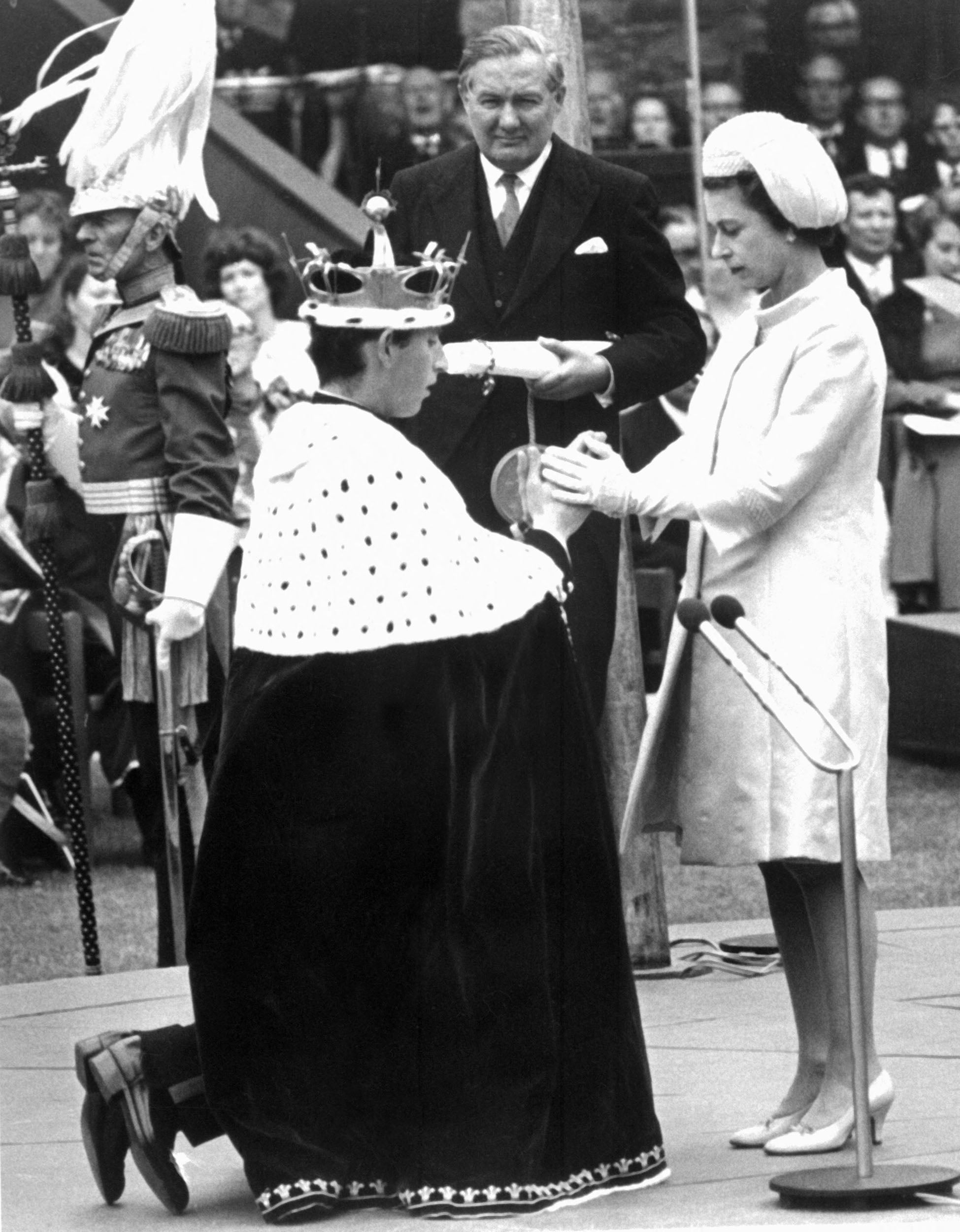 Charles knelt before his mother, Queen Elizabeth II, during his investiture as the Prince of Wales in 1969