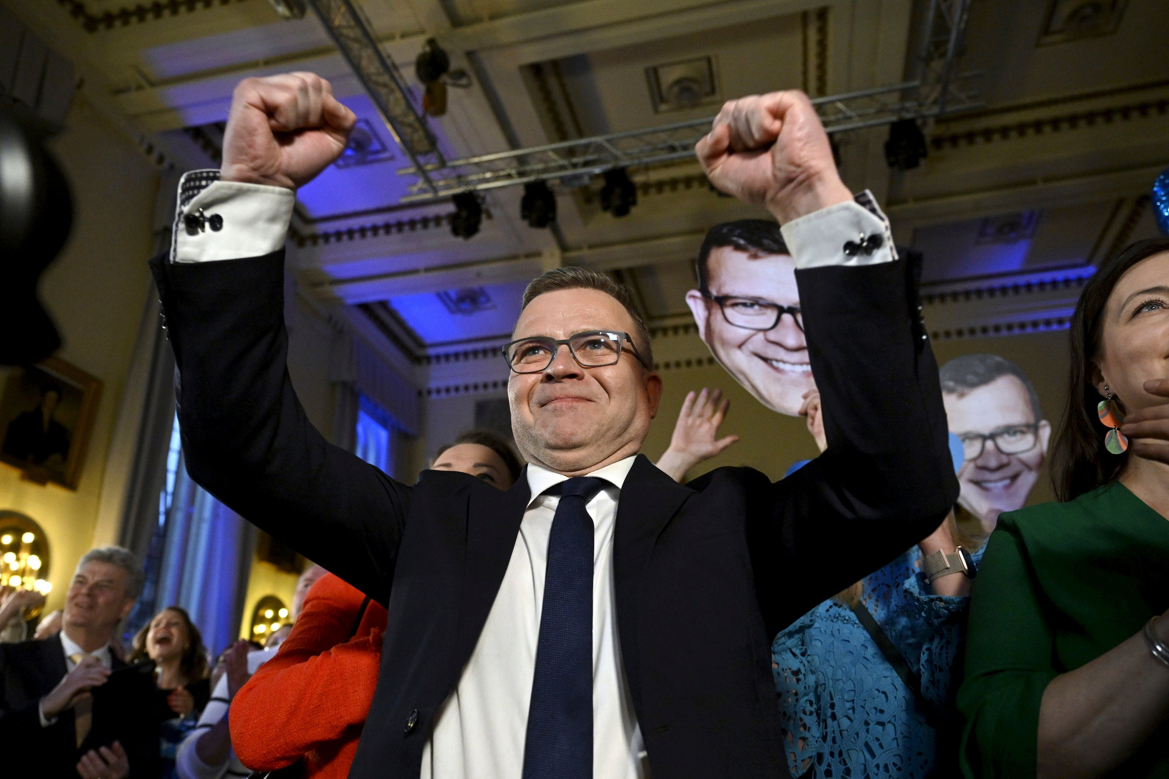 National Coalition Chairman Petteri Orpo celebrates at the party's parliament election wake after seeing the results of the advance votes in Helsinki, Finland