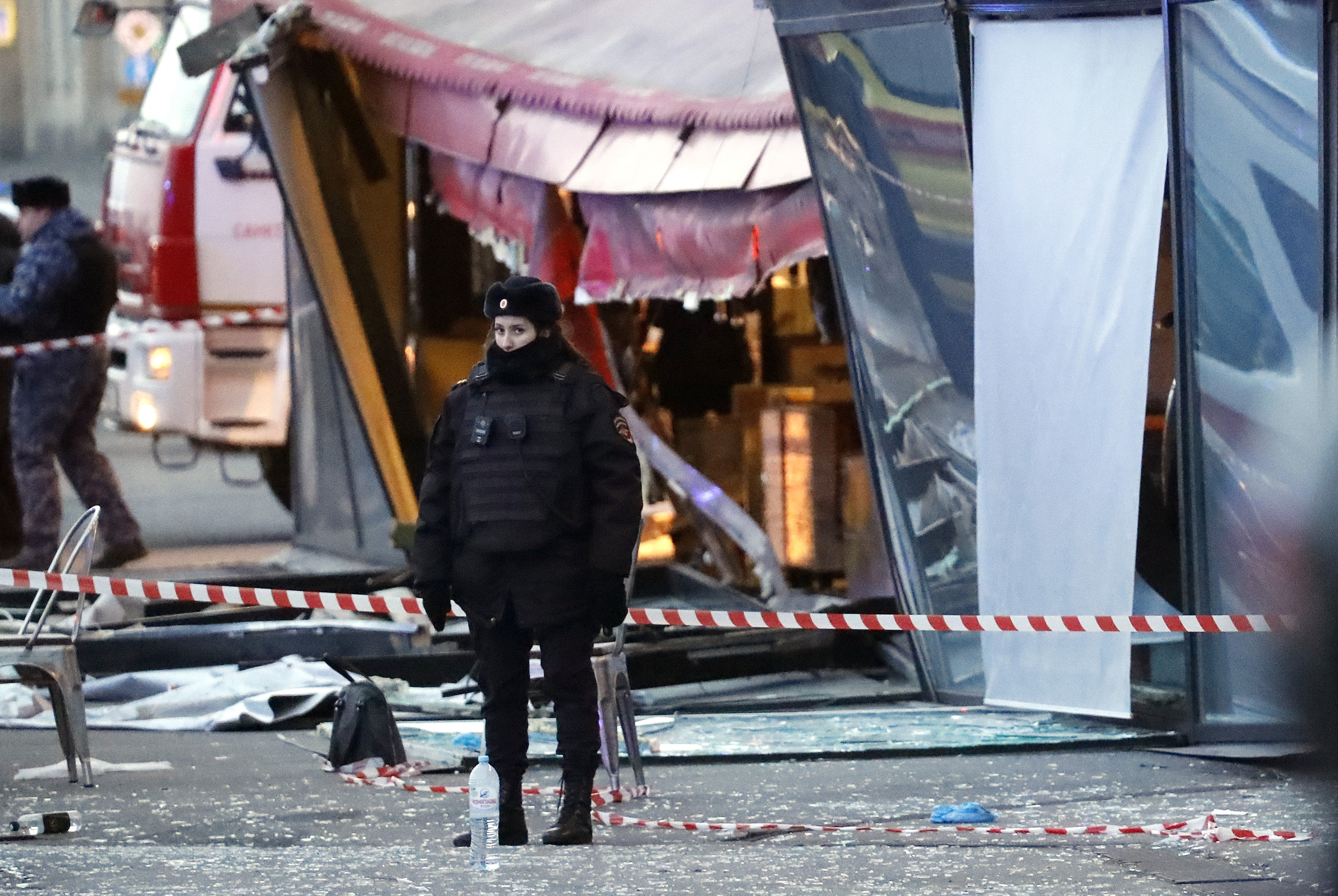 A police officer stands guard at the scene of an explosion at the cafe in St Petersburg, Russia