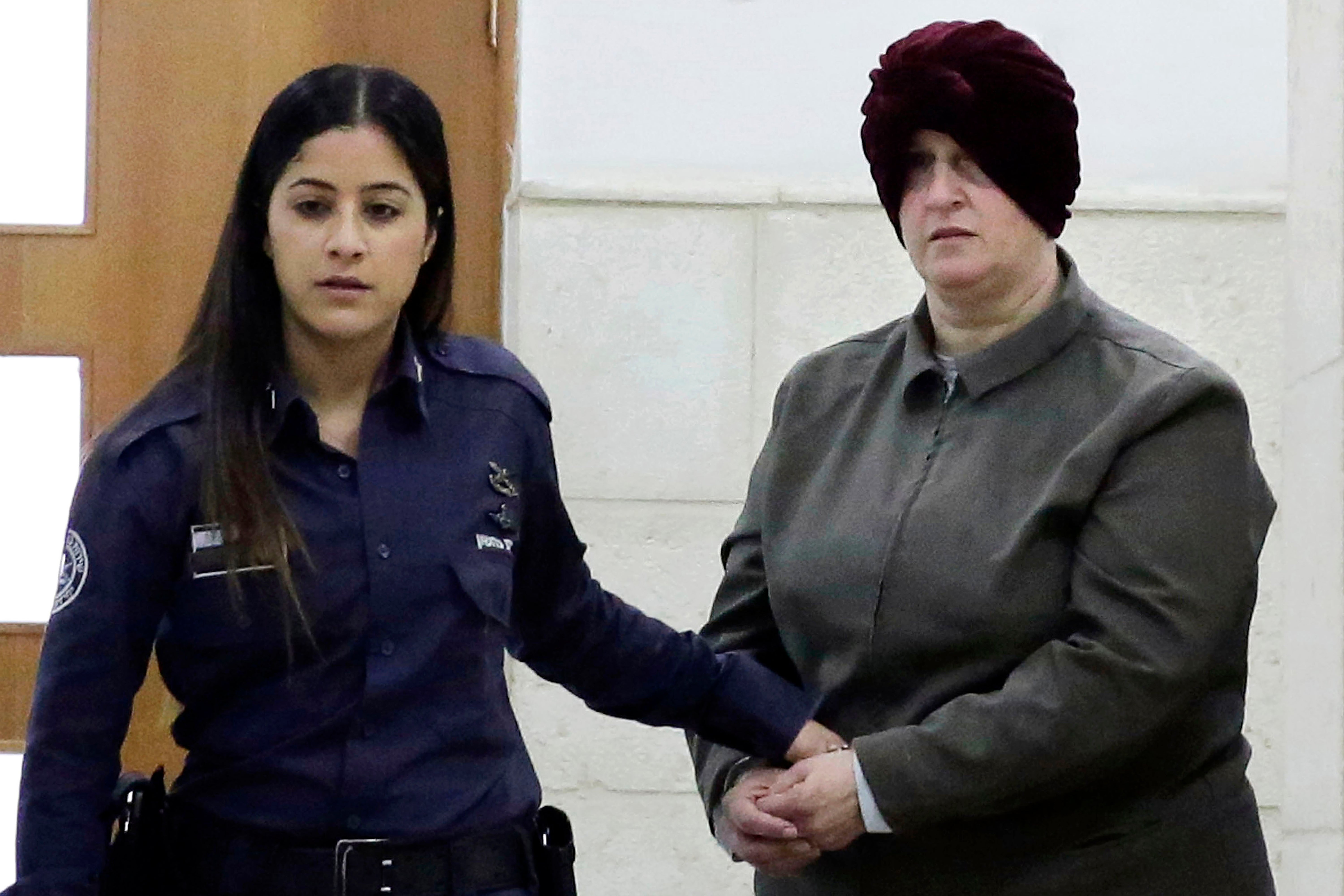 File Israeli-born Australian Malka Leifer, right, is brought to a courtroom in Jerusalem in 2018