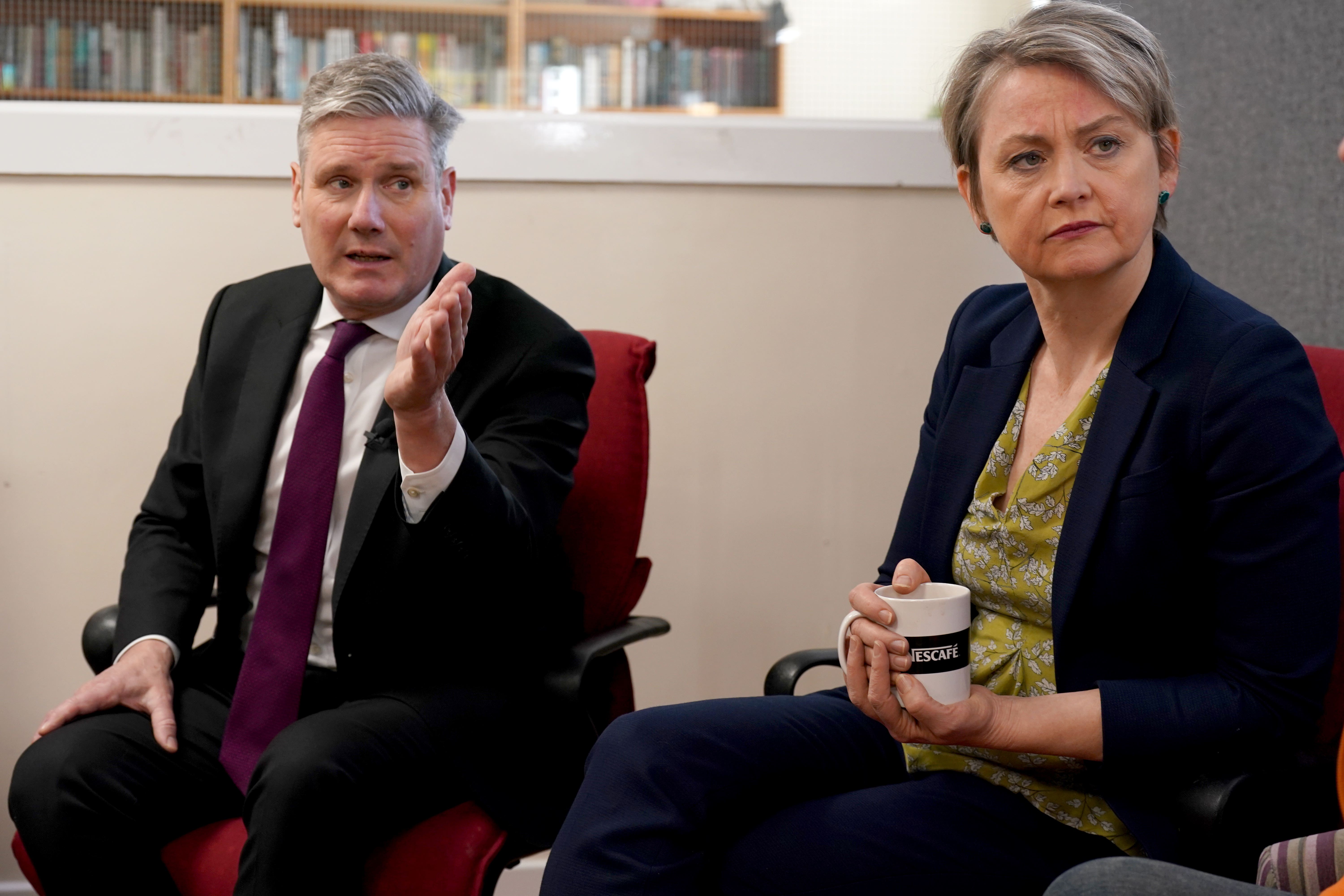 Yvette Cooper (right) distanced herself from the Labour attack ad