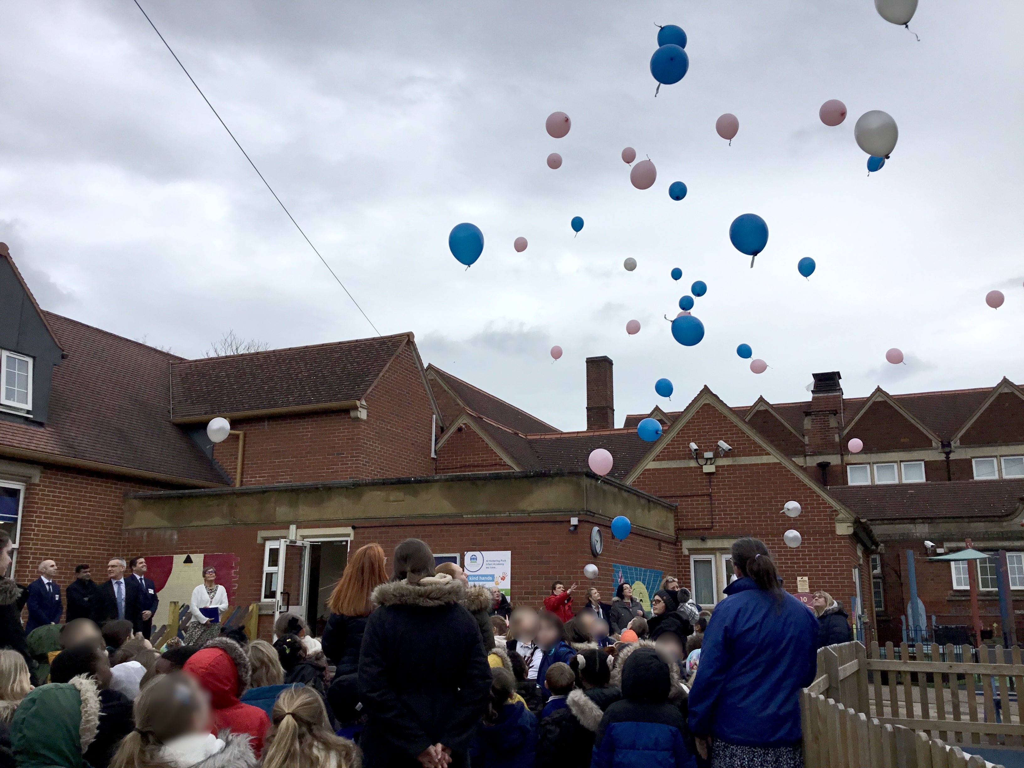 Jeeva and Janvi’s classmates release balloons into the sky as part of a rememberence ceremony for the murdered pupils