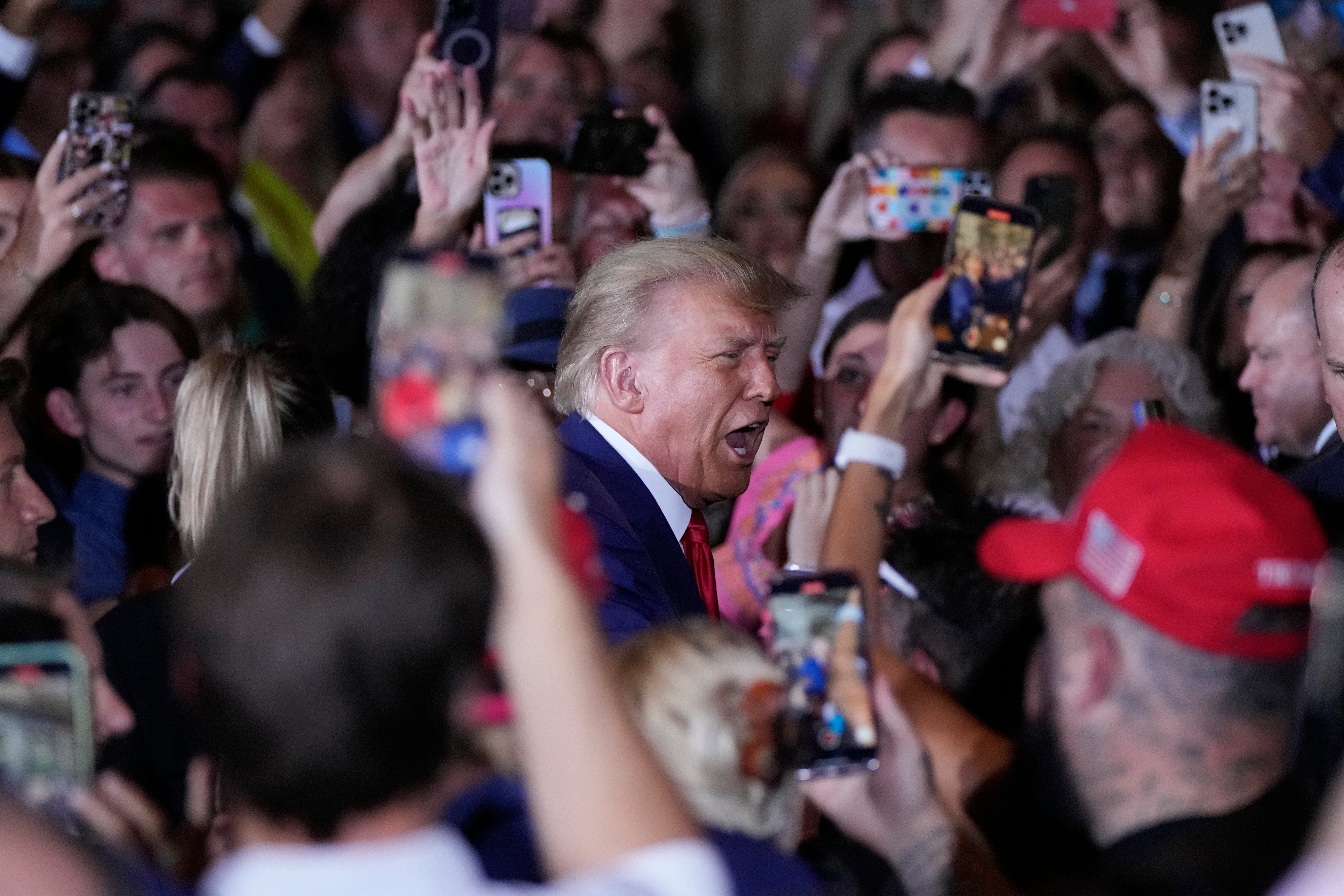 Former President Donald Trump arrives to speak at his Mar-a-Lago estate hours after being arraigned in New York City