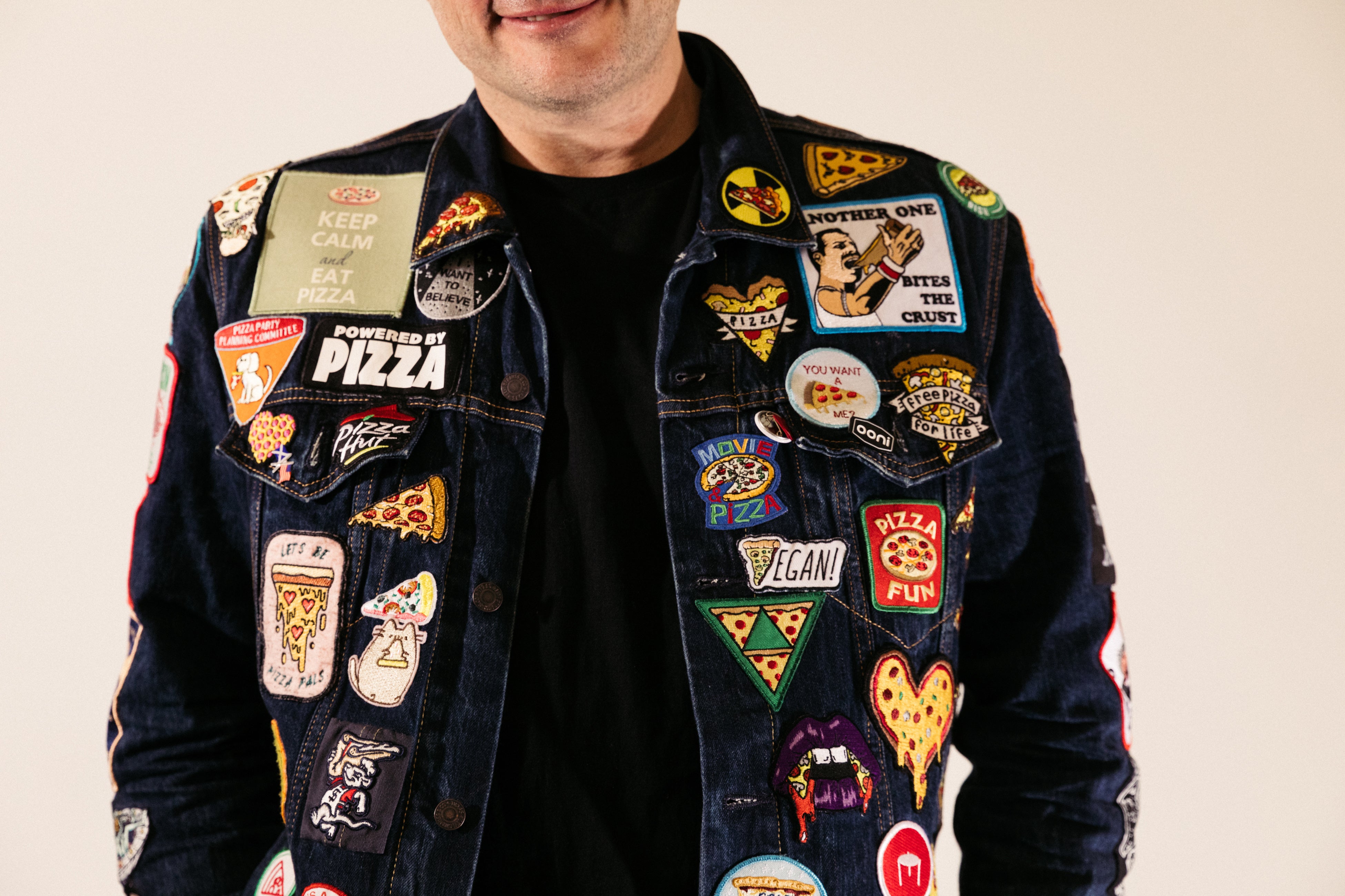 Arthur Bovino, head of pizza content for Ooni Pizza Ovens, displays a jacket he and his mother created