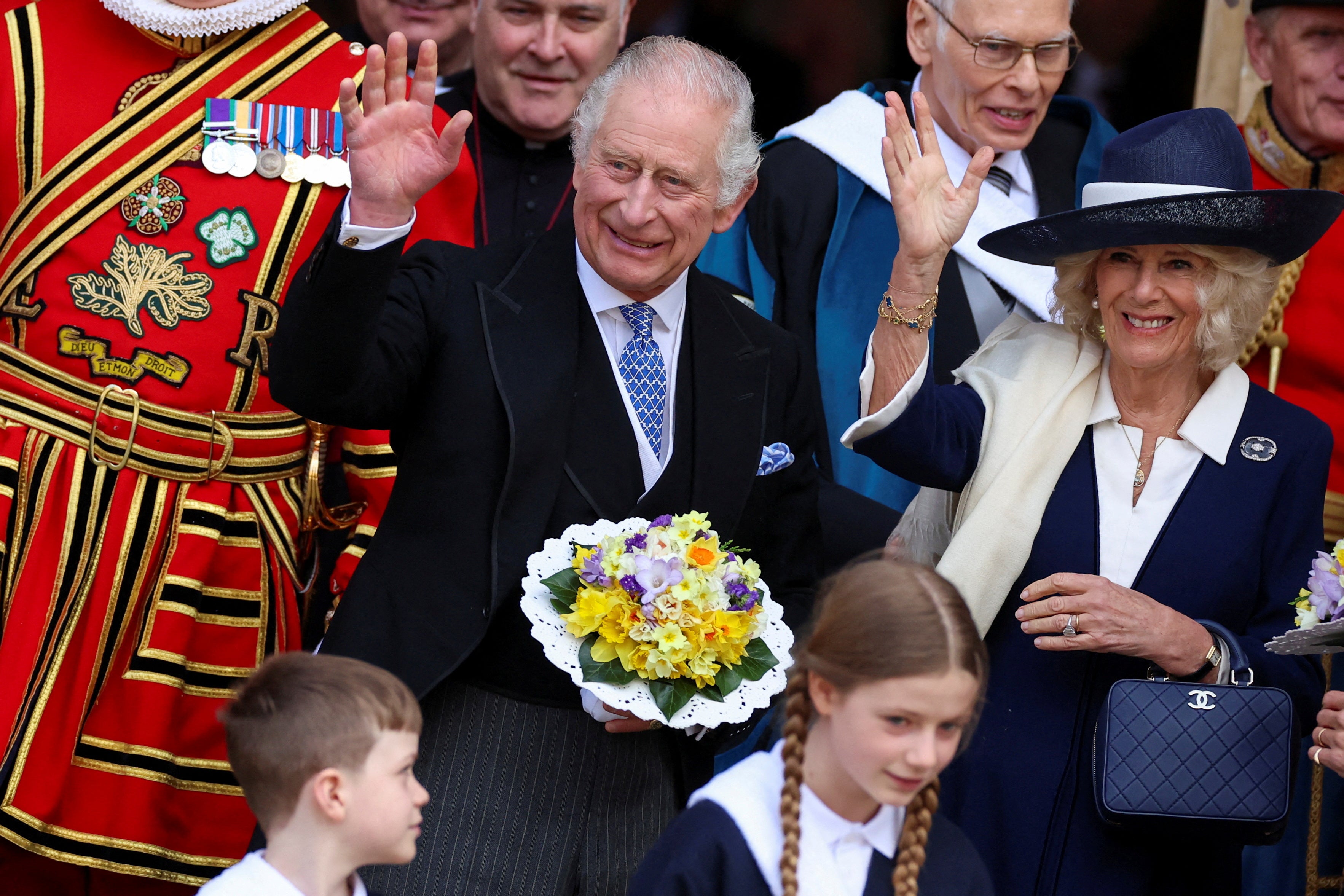 King Charles and Queen Camilla wave as they attend the Maundy Thursday Service at York Minster, in York, Britain, April 6, 2023