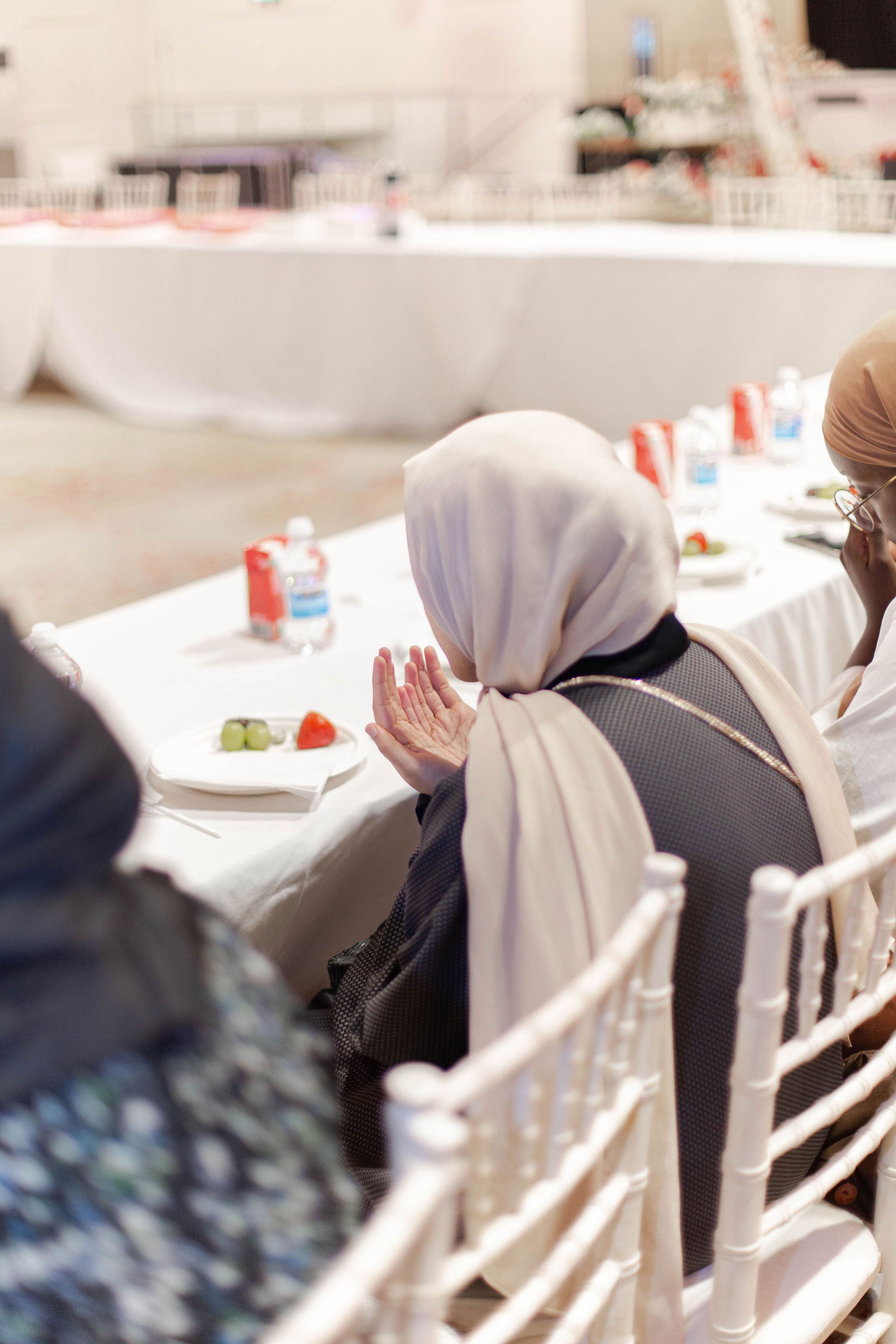 Guests supplicating before they open their fast