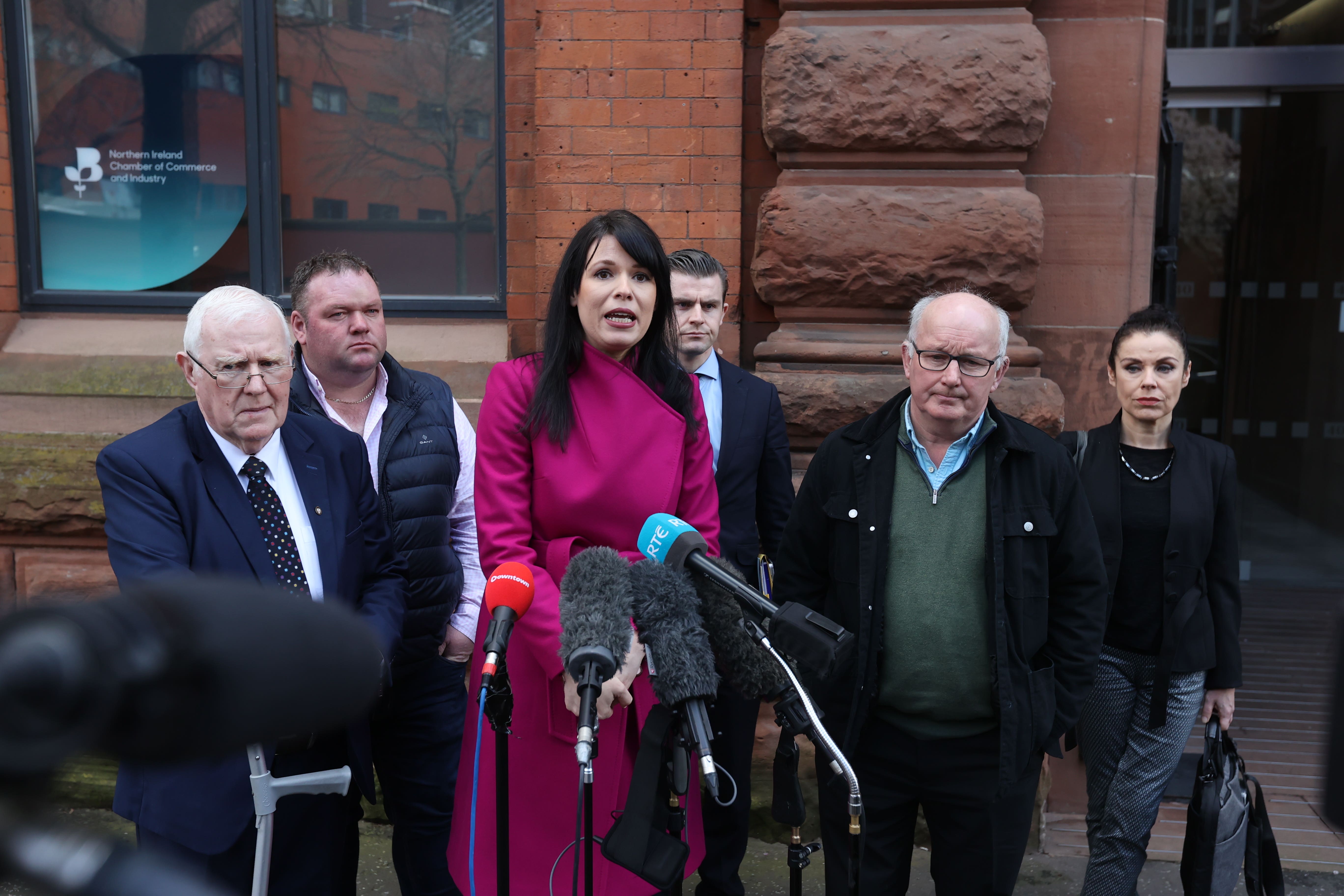 From left, Eugene Reavey, Eugene Oliver, Grainne Teggart from Amnesty UK , solicitor Darragh Mackin, Gerry McAnespie and Fiona Crowley from Amnesty International (PA)