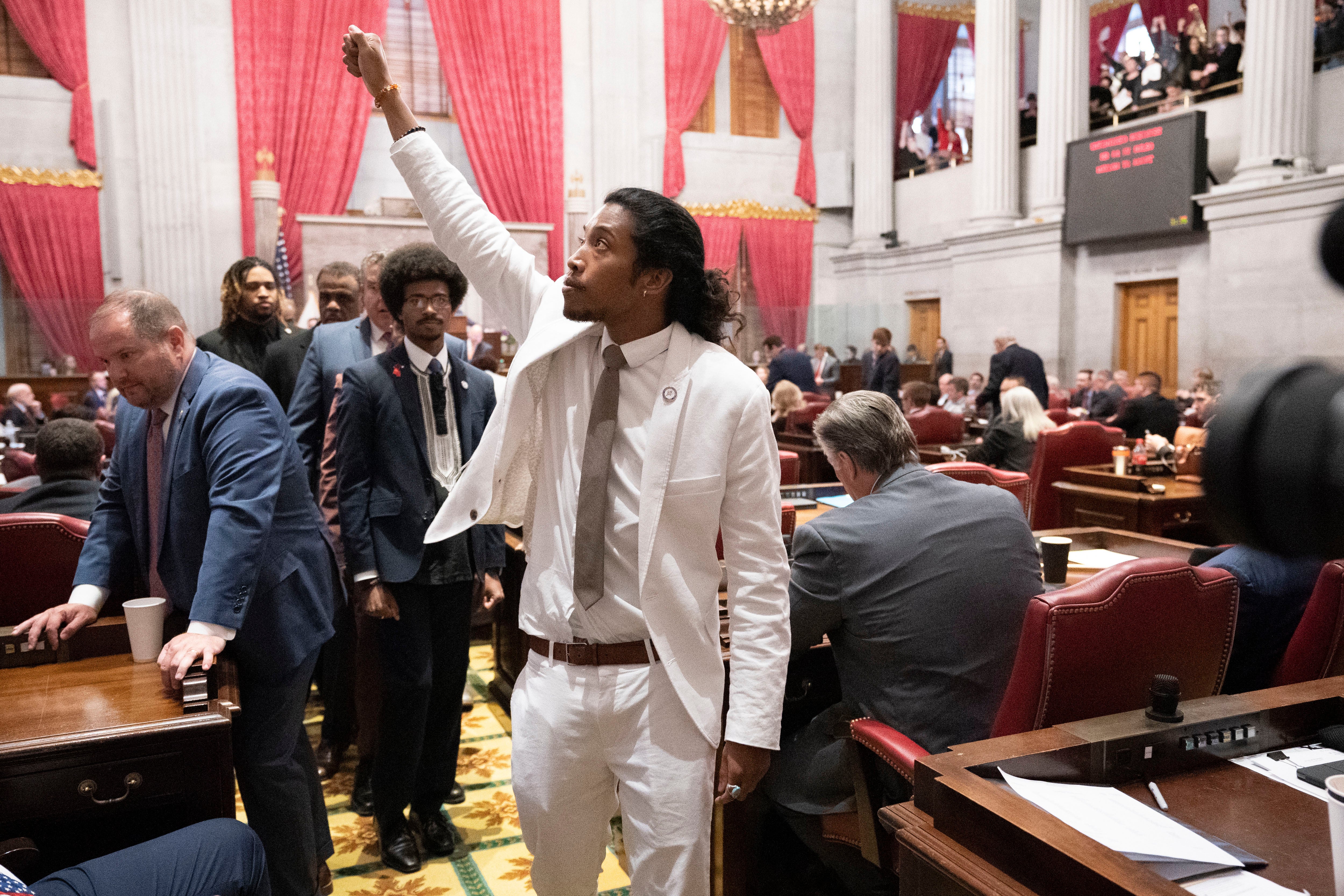 Rep Justin Jones gestures to supporters