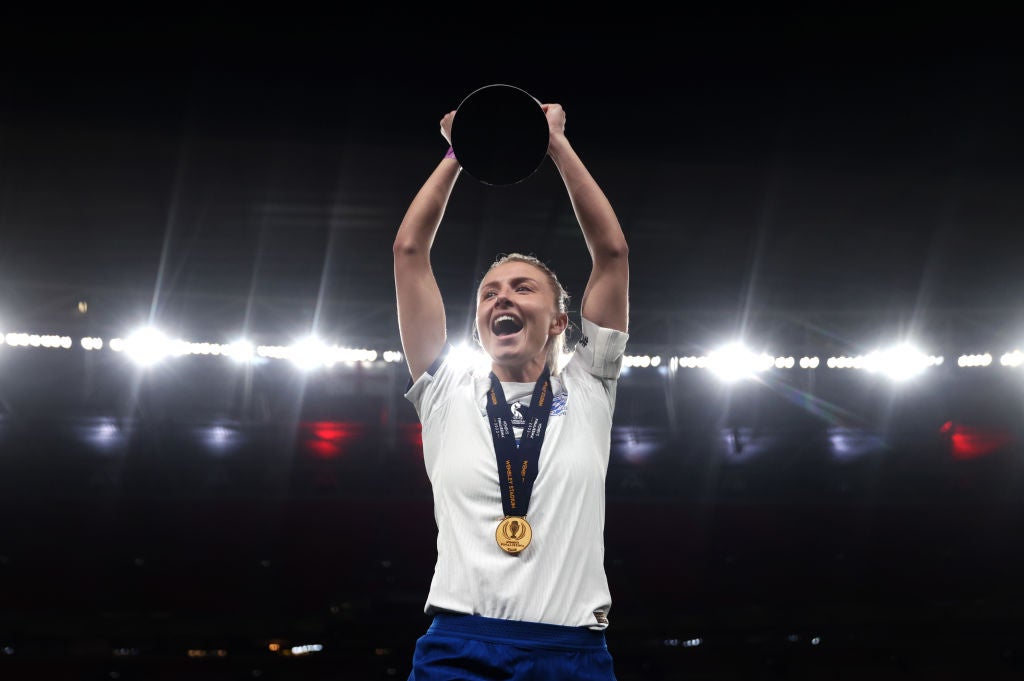 Williamson holds aloft the trophy at Wembley