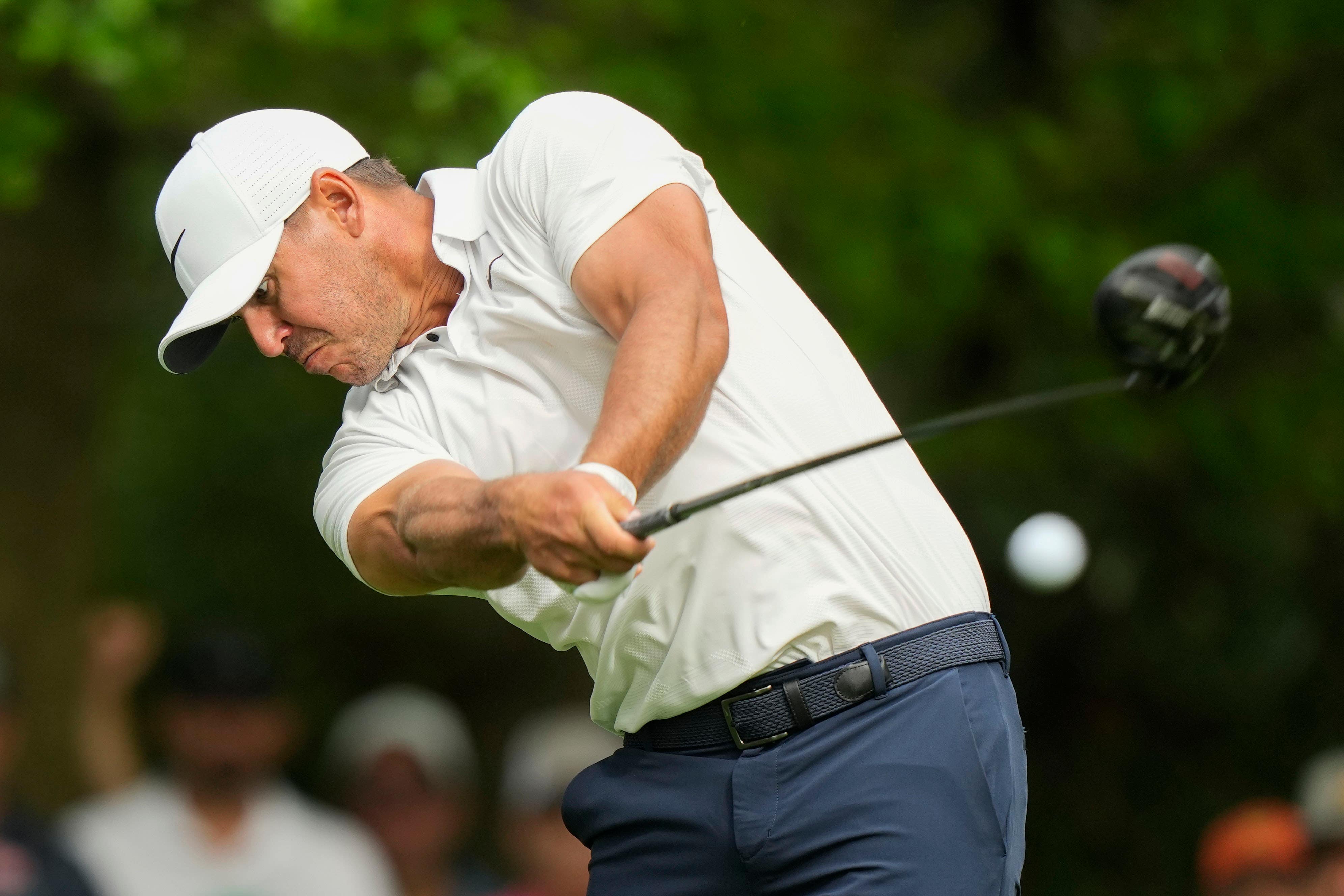 Brooks Koepka hits his tee shot on the seventh hole during the second round of the 87th Masters (Charlie Riedel/AP)