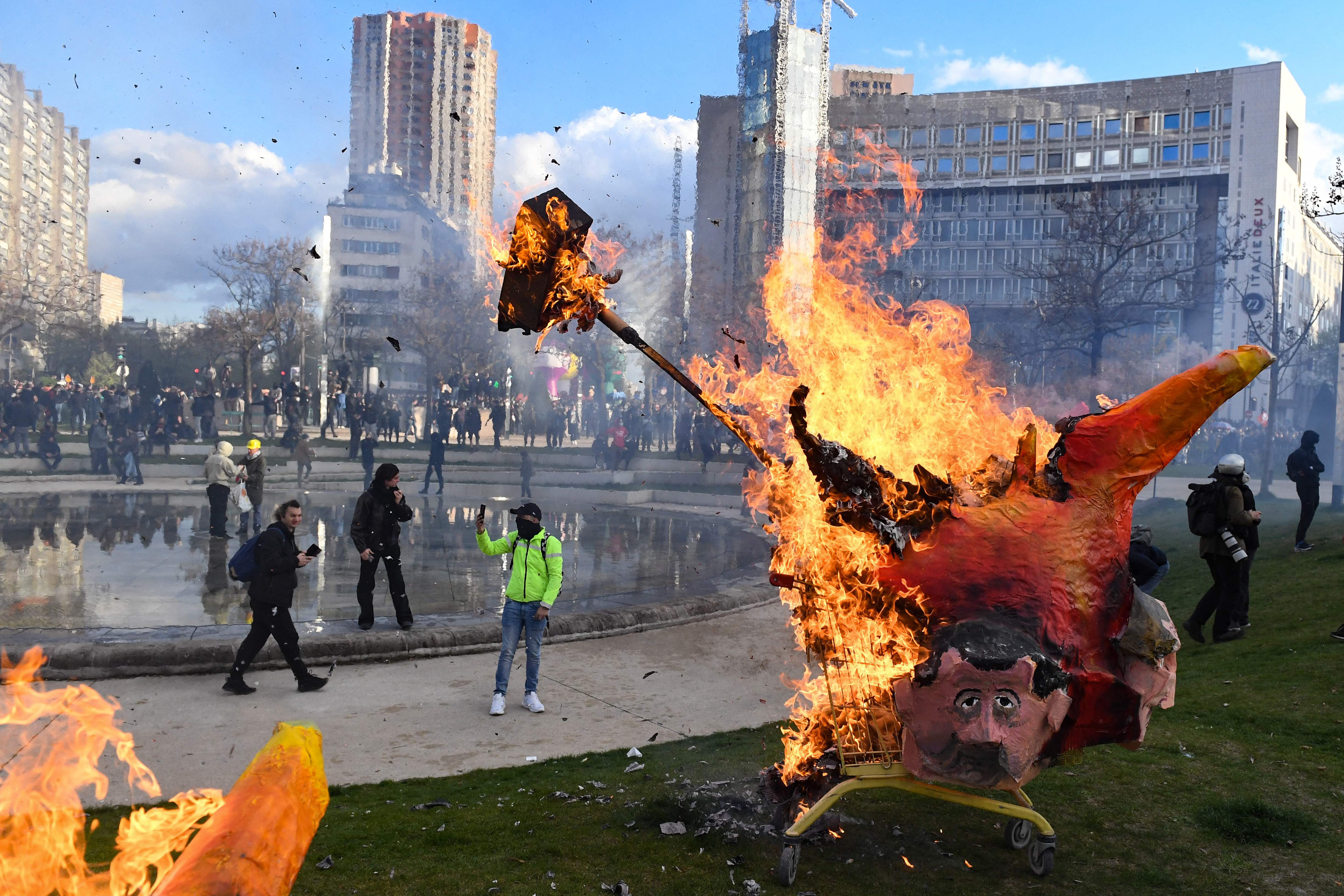 Effigy of Macron burnt by protesters