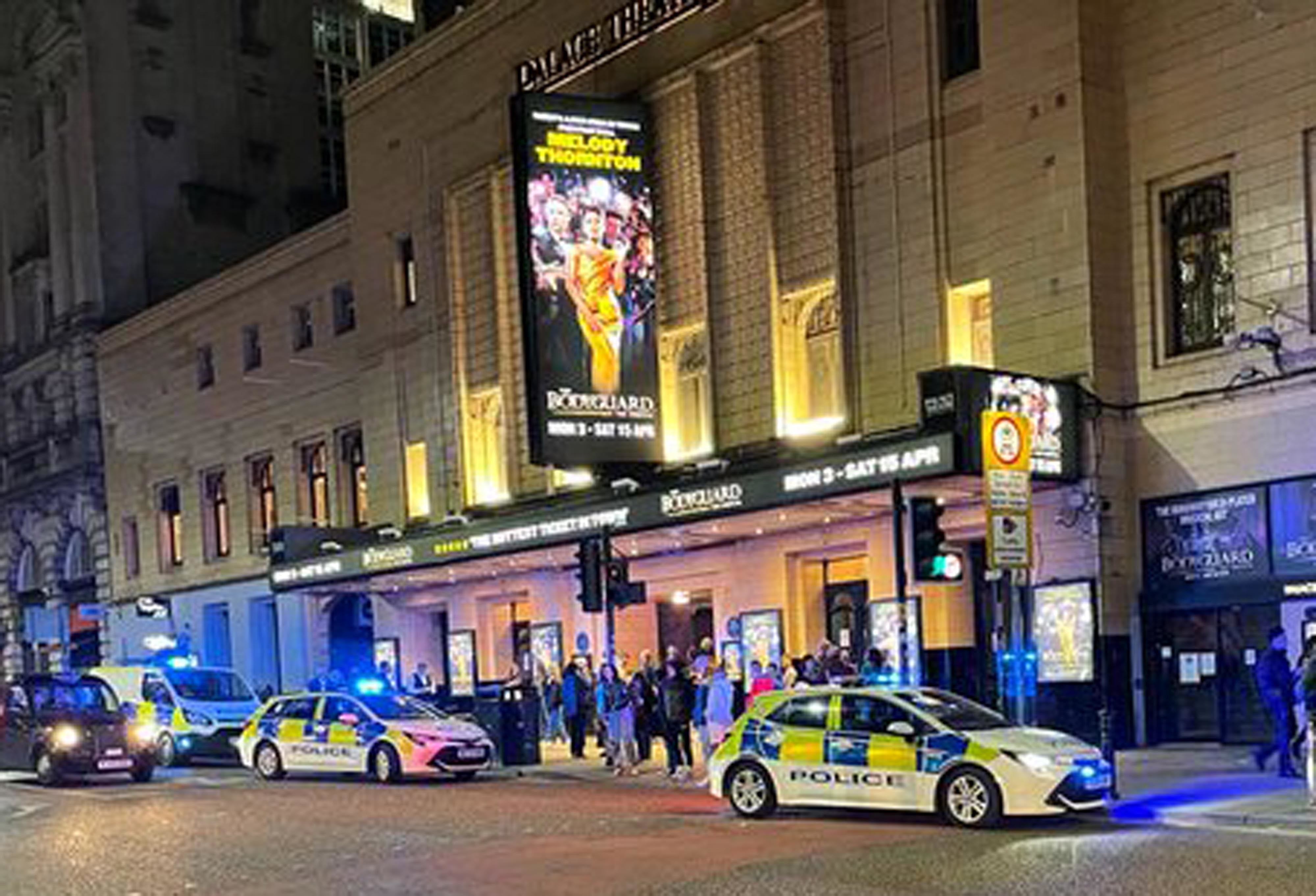 Police outside the Palace Theatre in Manchester after some members of the audience refused to remain seated and refrain from loudly singing