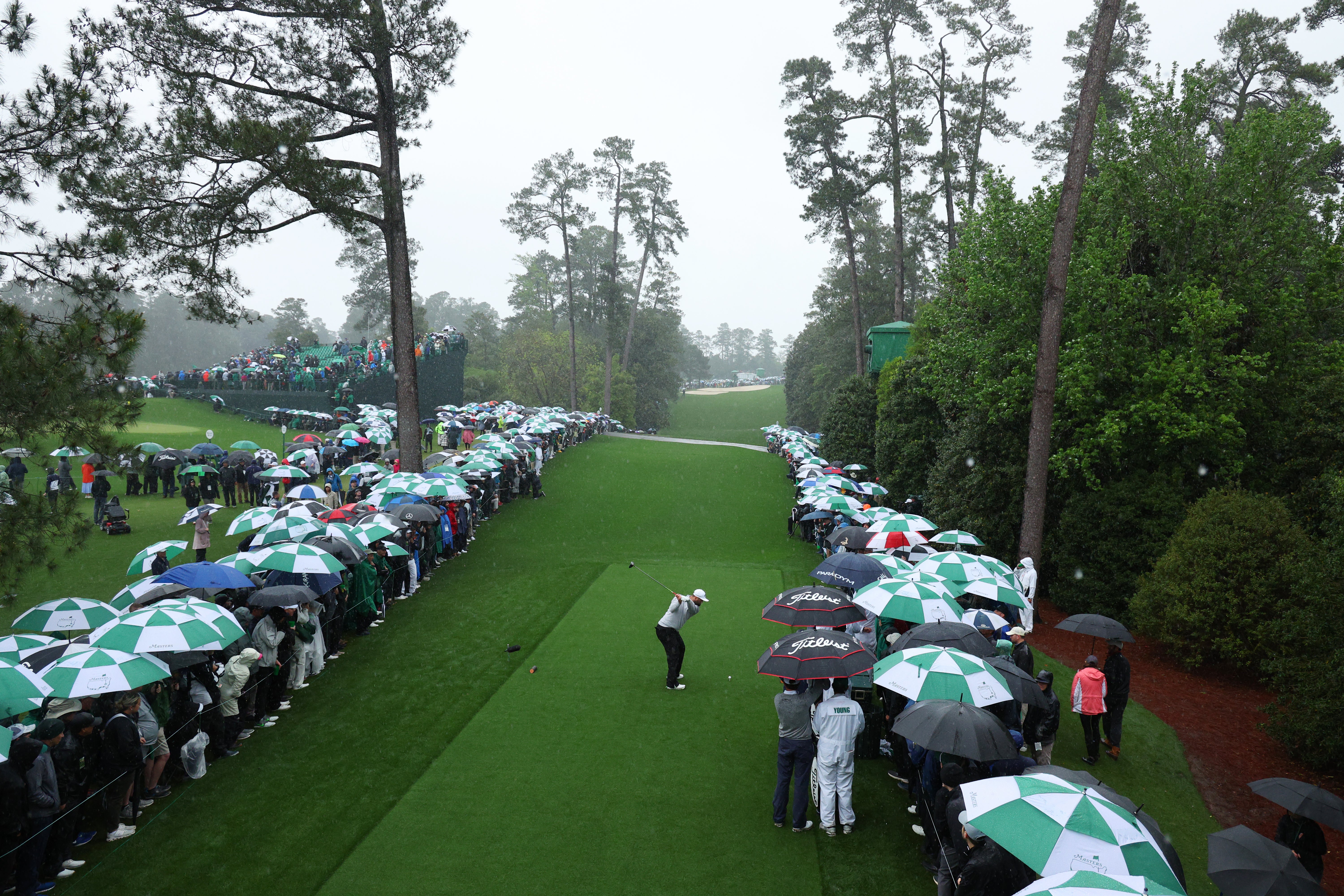 Jon Rahm of Spain plays his shot from the 18th tee