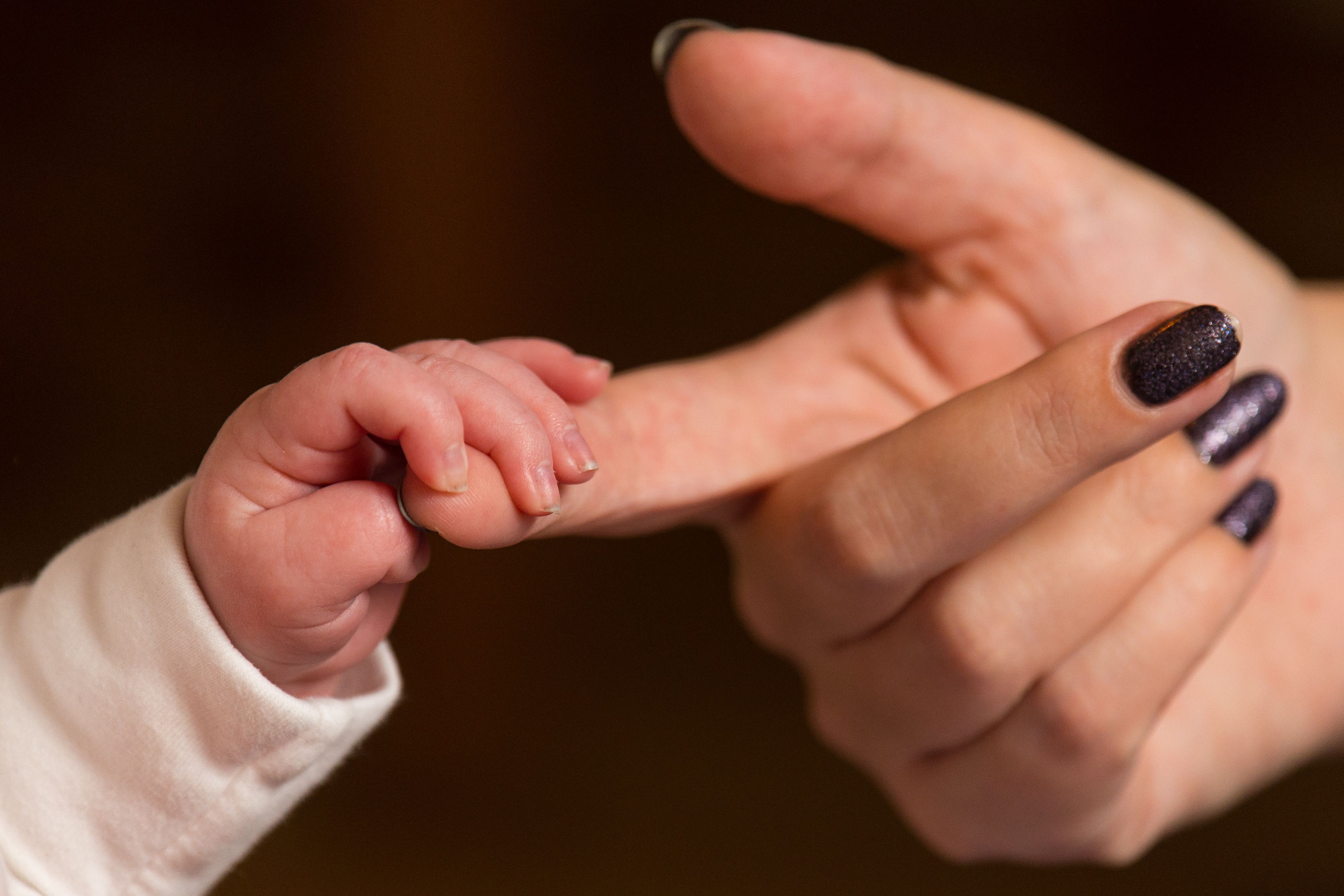 The financial support for mothers taking time off to care for their newborn will increase from Monday (Dominic Lipinski/PA)