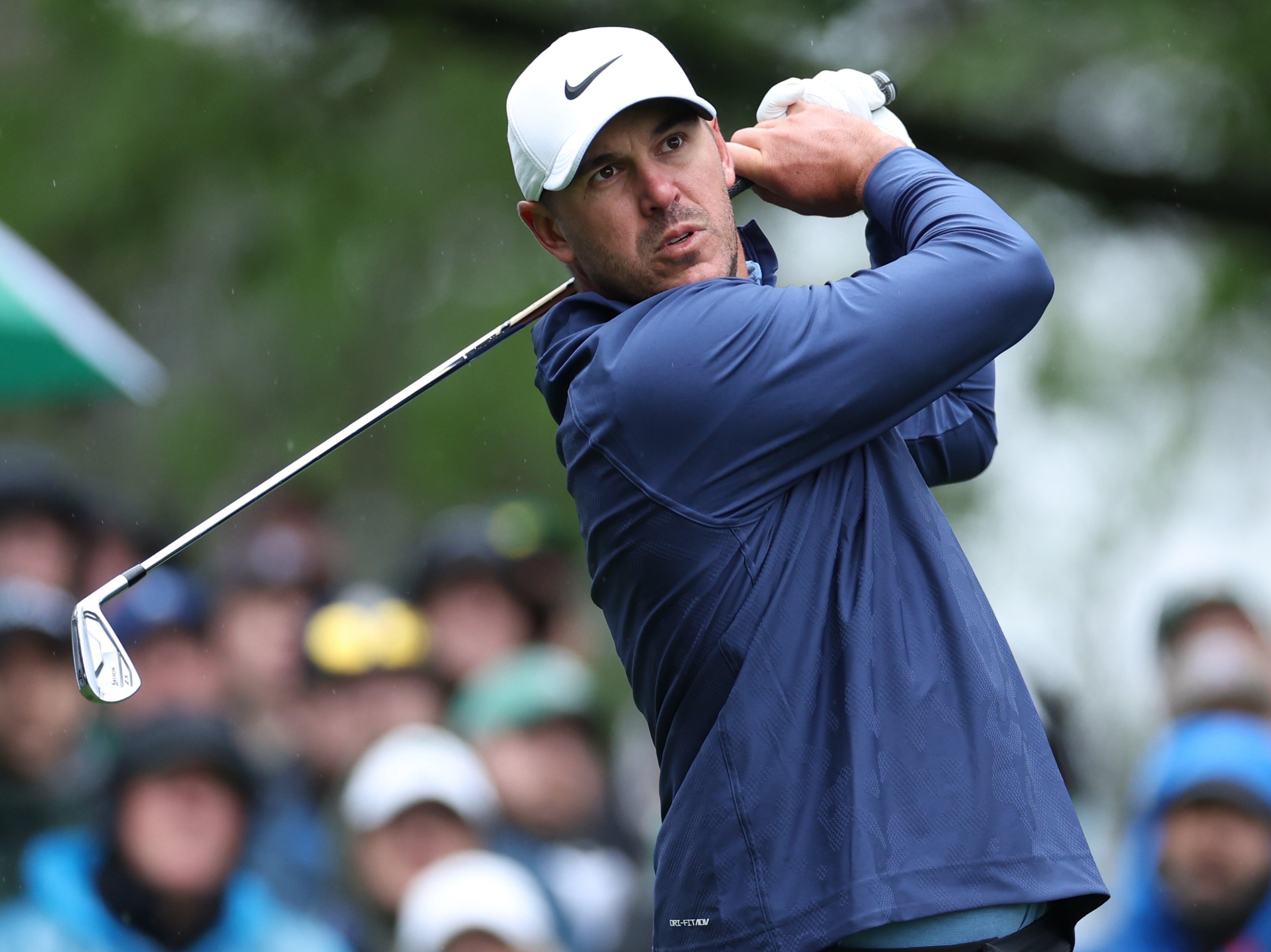 Brooks Koepka hits a tee shot on the fourth