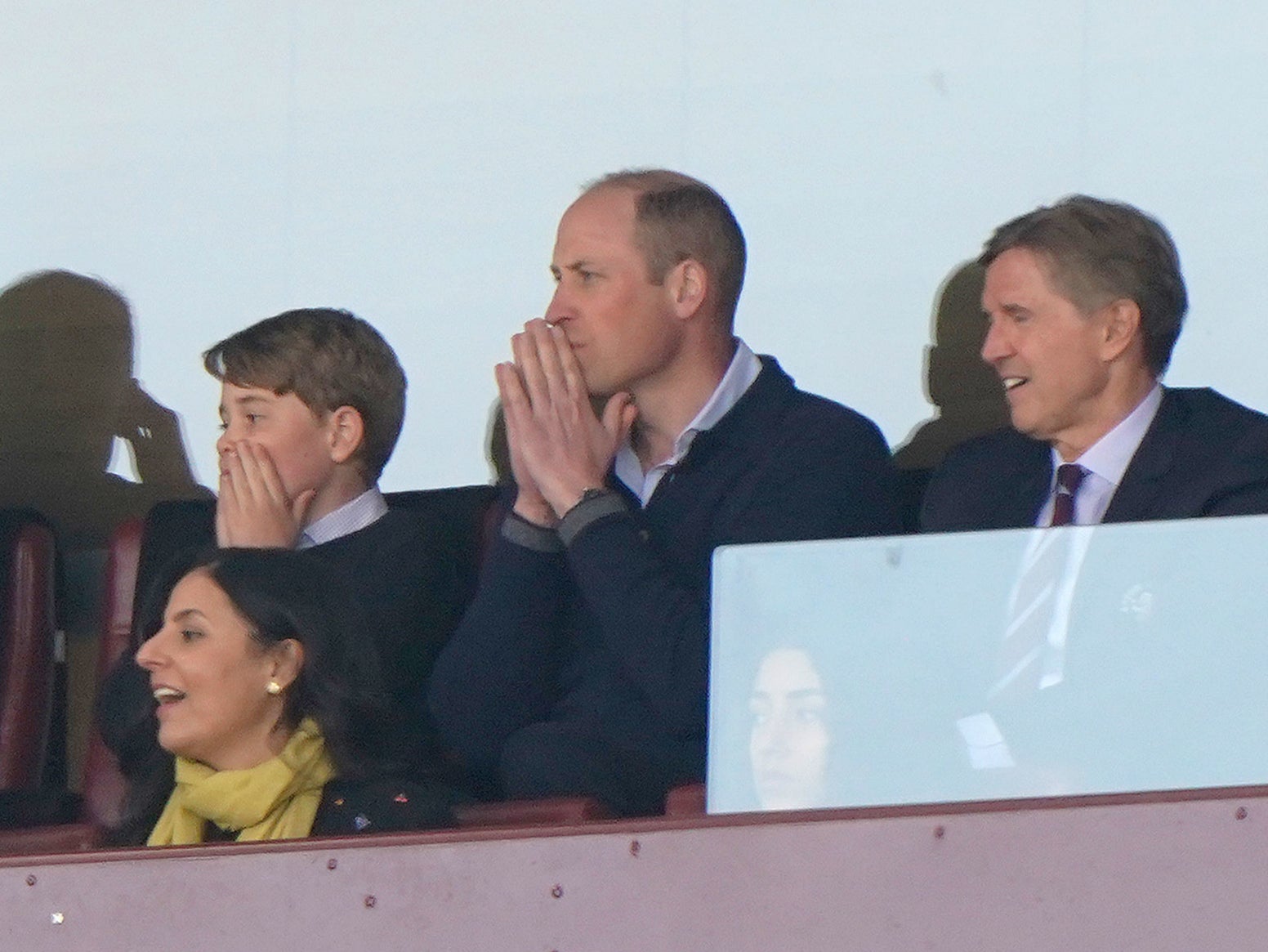 The Prince of Wales with Prince George of Wales and Aston Villa chief executive Christian Purslow (right) in the stands during the Premier League match at Villa Park, Birmingham