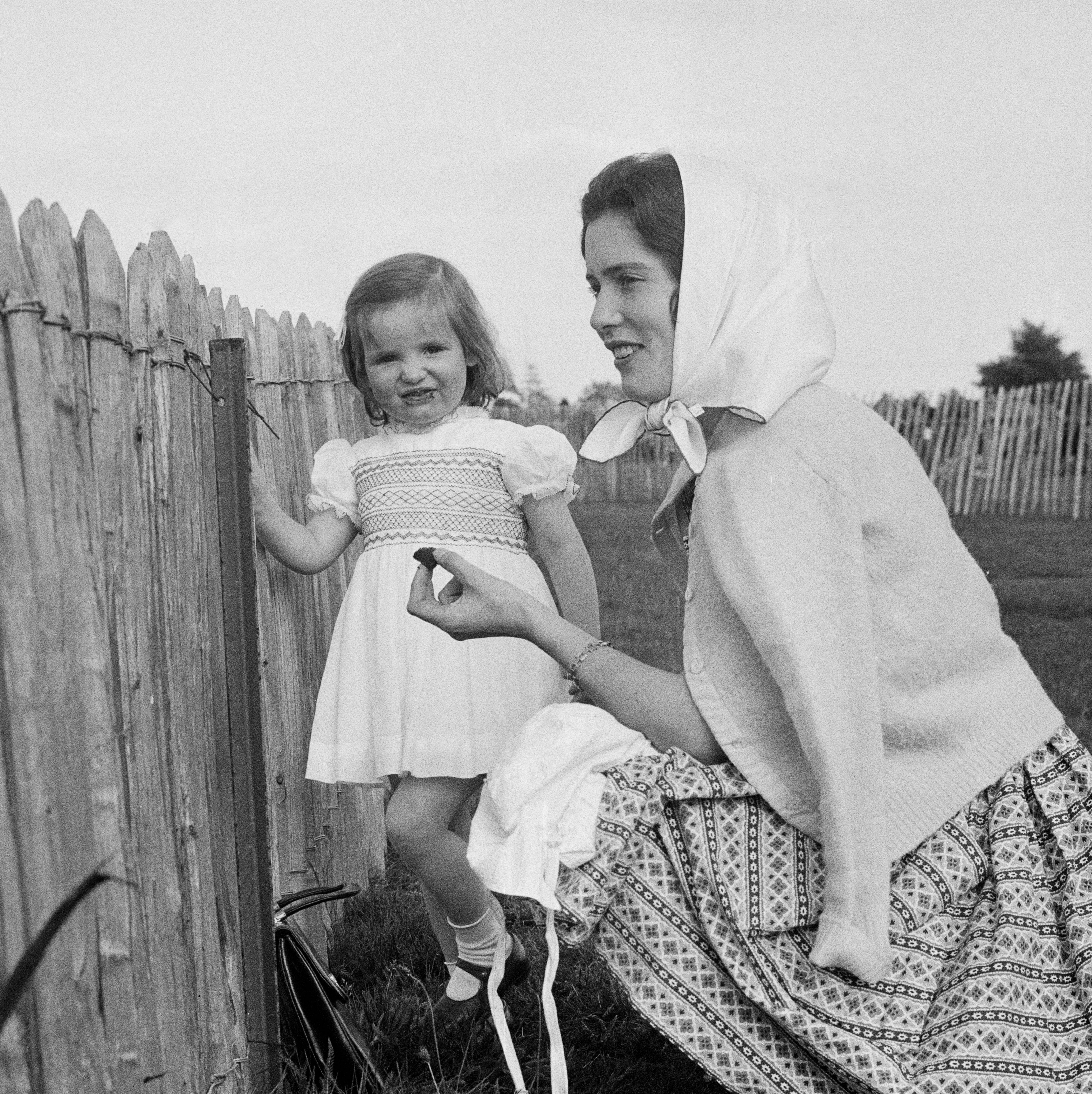 Susan Ferguson (later Barrantes, 1937 - 1998) watching a polo match with daughter Jane on June 1st, 1960