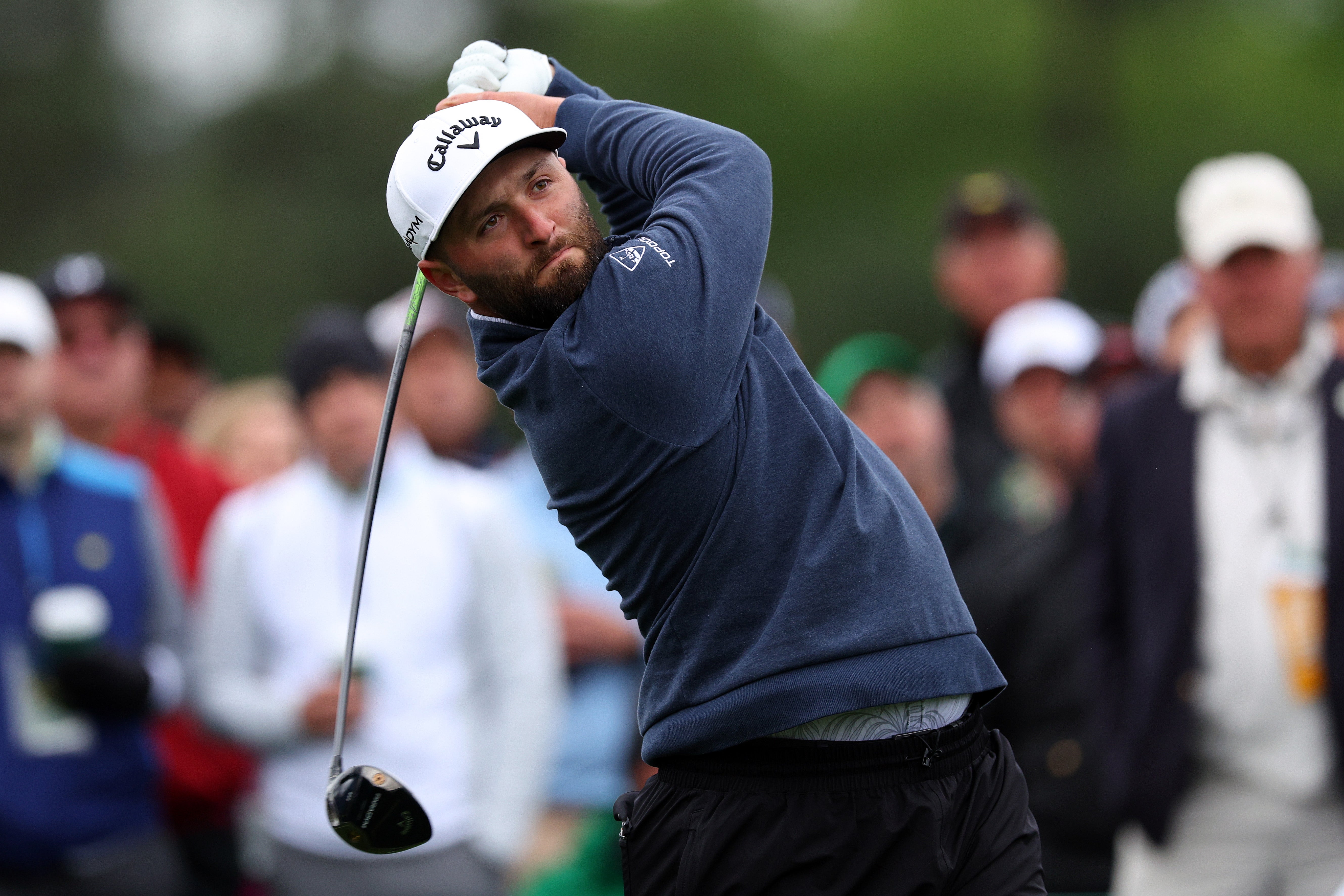 Jon Rahm drives from the eighth tee box