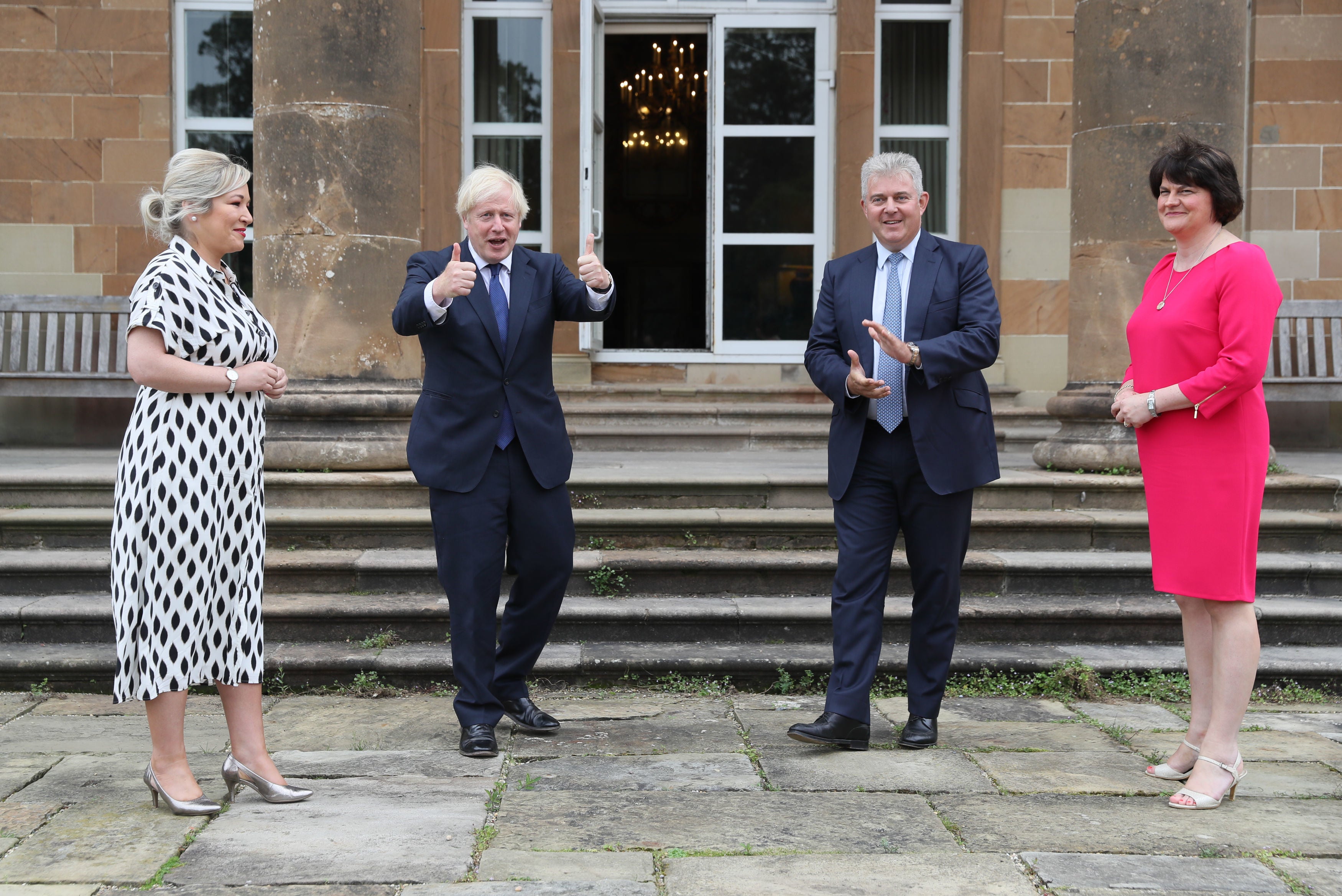 Left to right: Northern Ireland’s then-deputy first minister Michelle O’Neill, Boris Johnson, the UK’s then-Northern Ireland secrmetary, Brandon Lewis, and then-first minister Arlene Foster at Hillsborough Castle in Belfast in August 2020