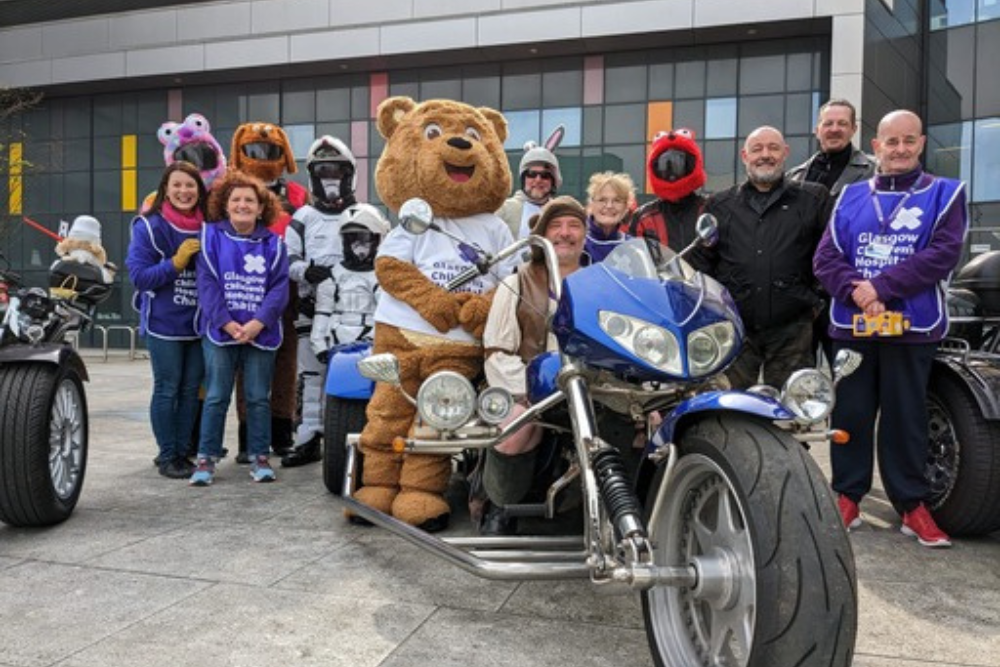 Charity mascot Kami Bear, volunteers and bikers at the Royal Hospital for Children in Glasgow. (Glasgow Children’s Hospital Charity/PA)