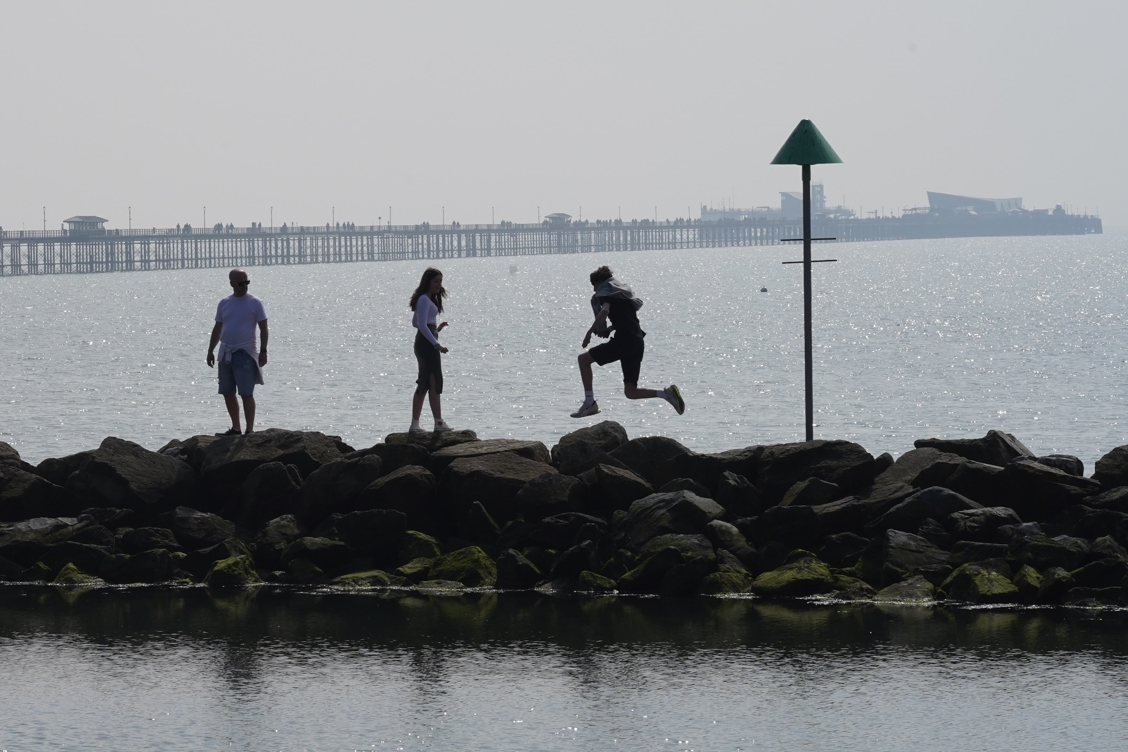 People enjoying the warm weather on Southend-on-Sea beach over the Easter bank holiday weekend (Stefan Rousseau/PA)