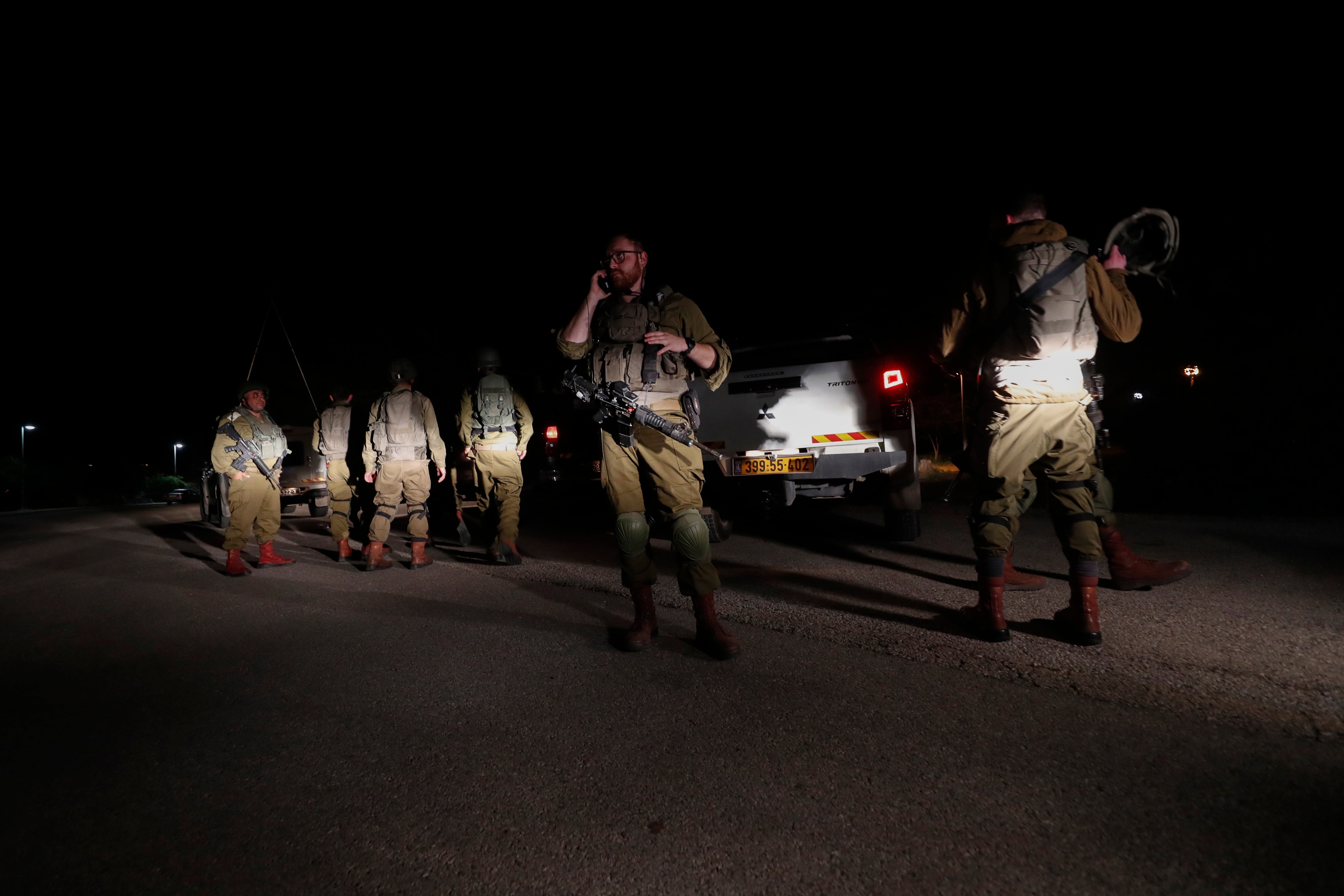 Israeli soldiers on alert after a rocket launched from Syria landed nearby, in Golan Heights