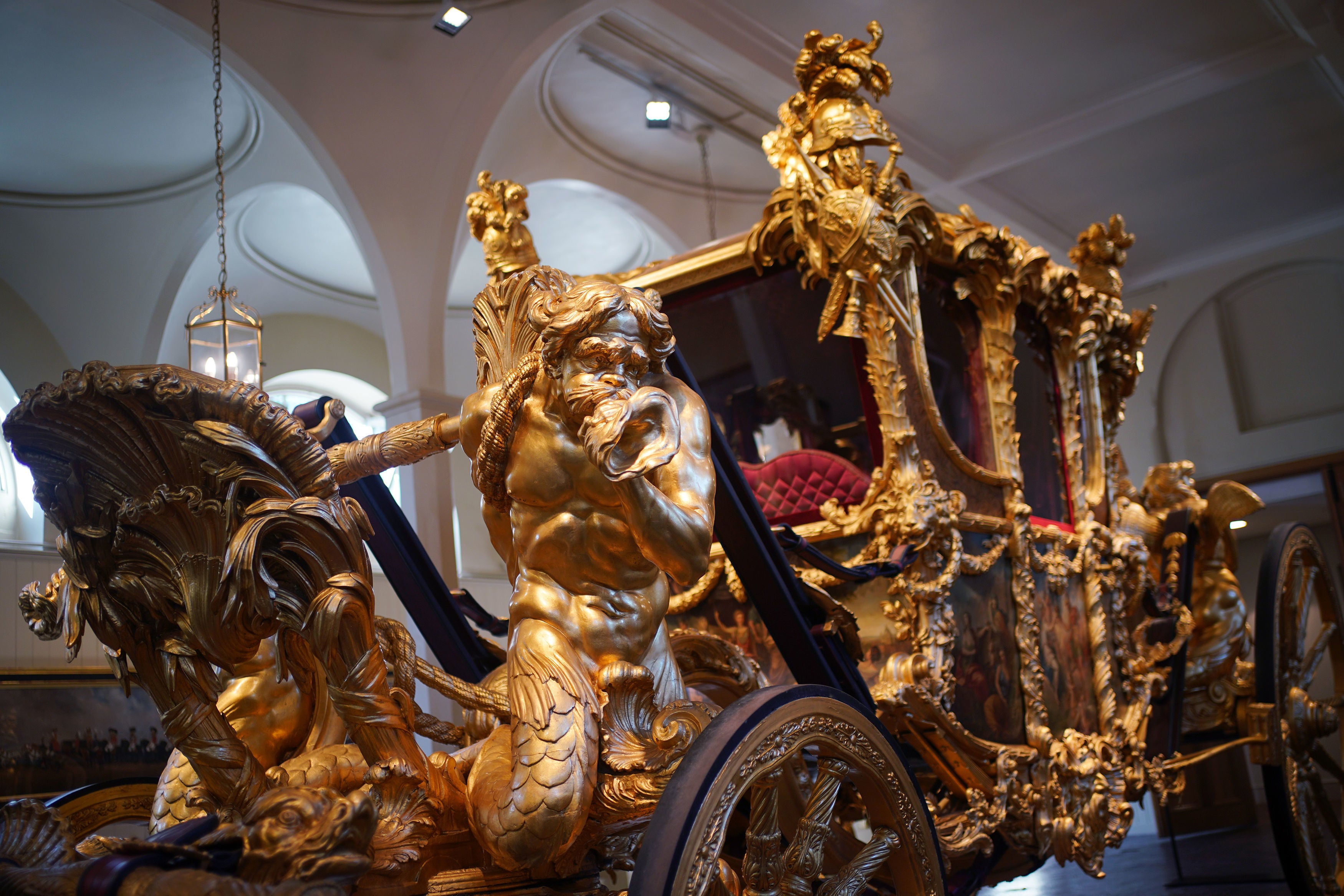 The Gold State Coach is displayed at the Royal Mews