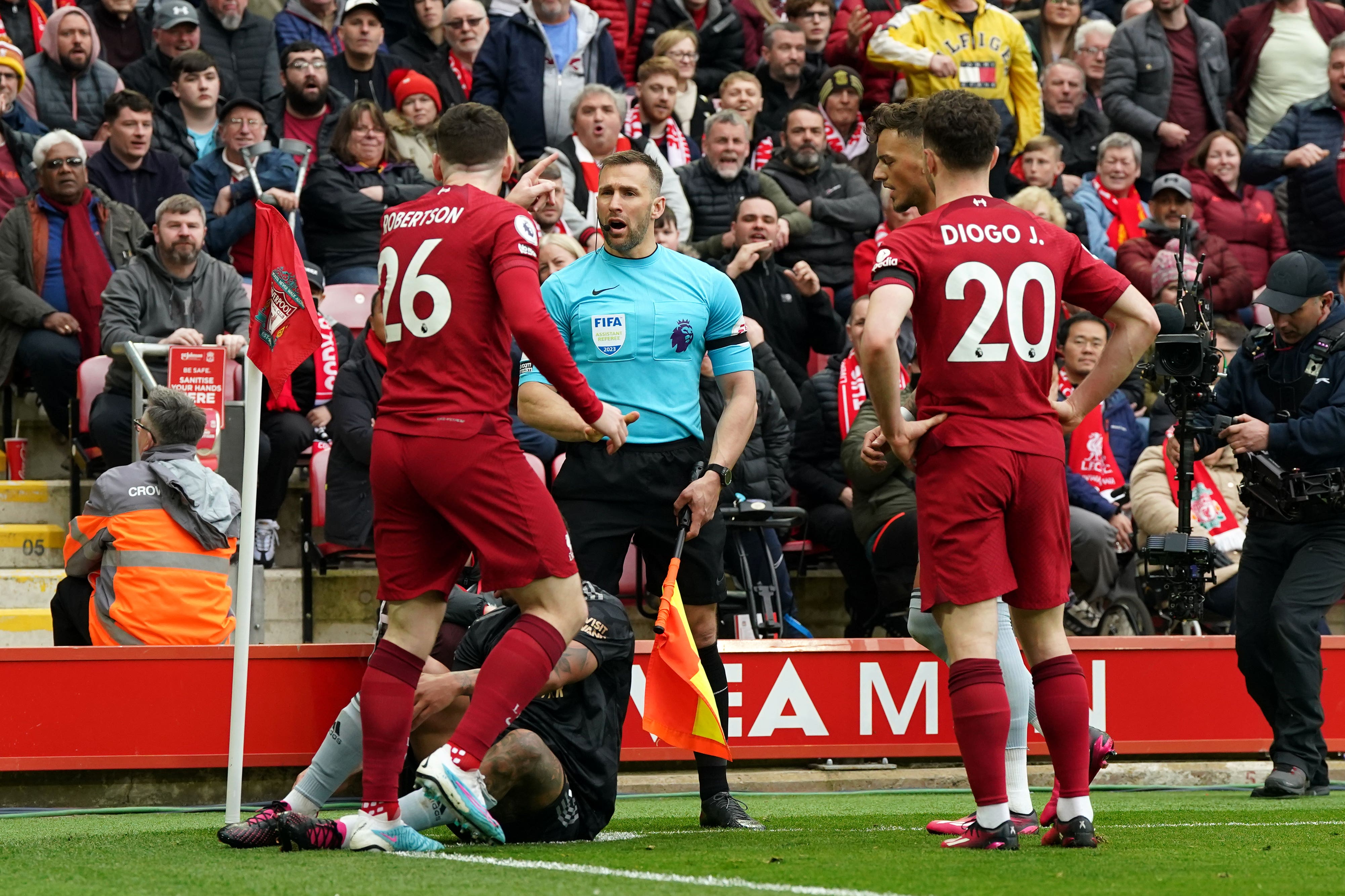 Liverpool’s Andy Robertson (left) confronts linesman Constantine Hatzidakis during the game (Nick Potts/PA)