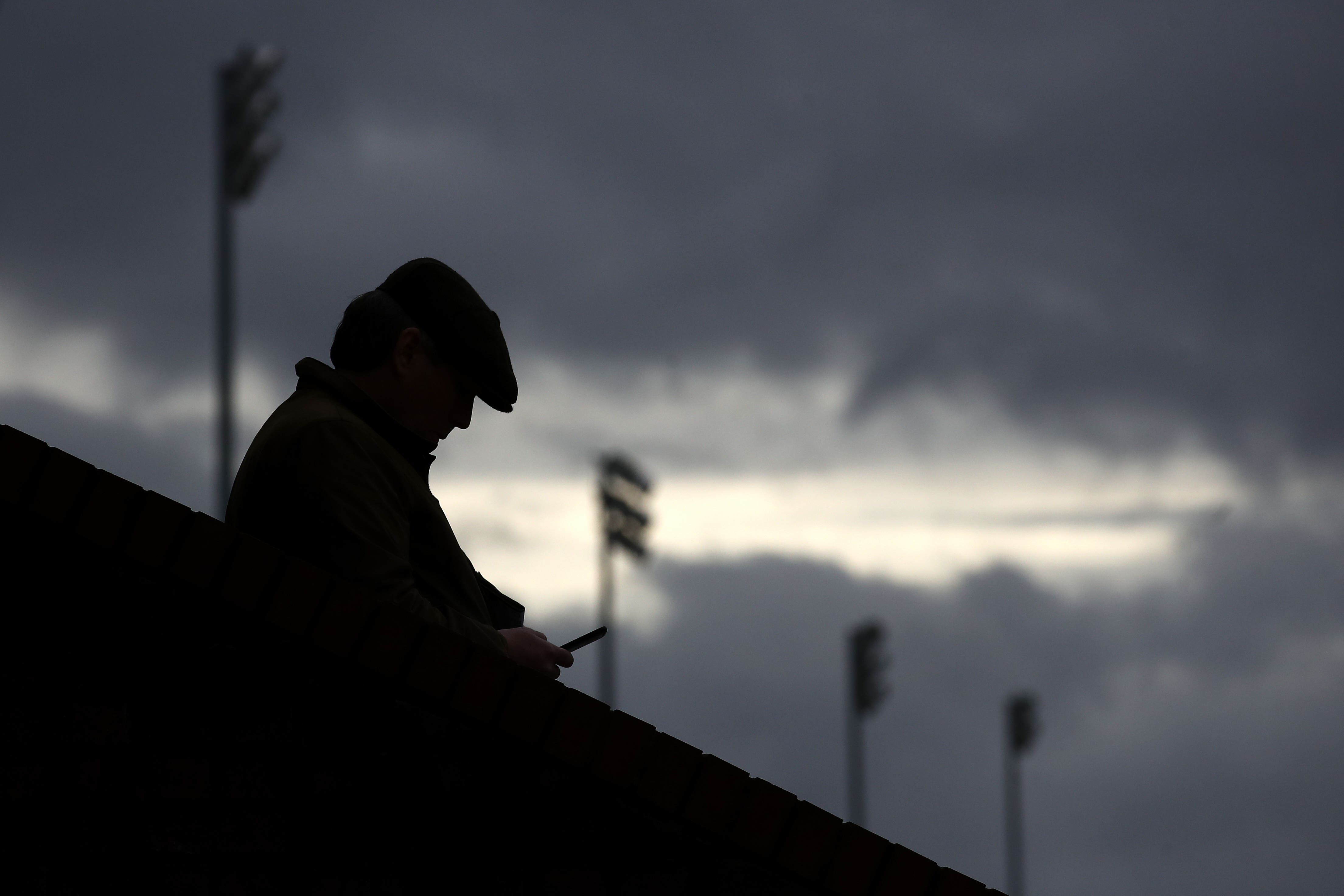 Someone using a mobile phone (Tim Goode/PA)