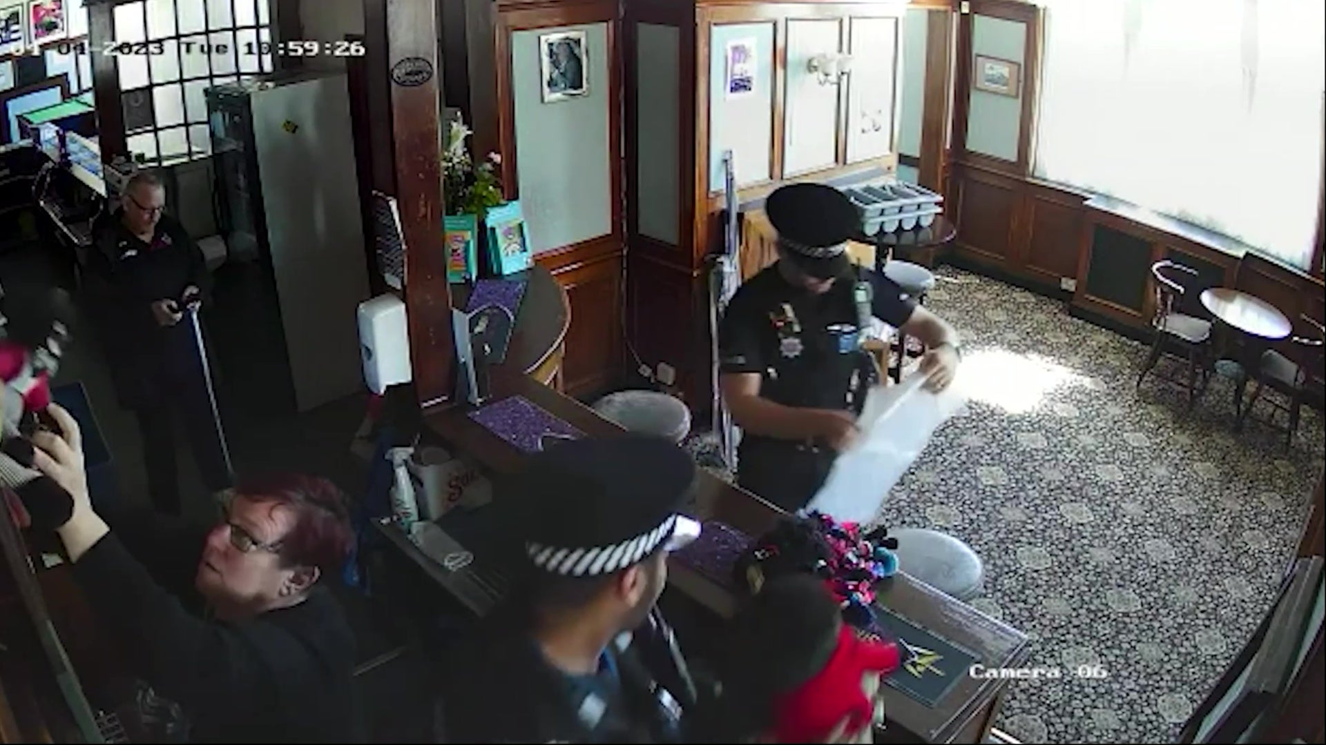 Officers enter the pub to remove the dolls