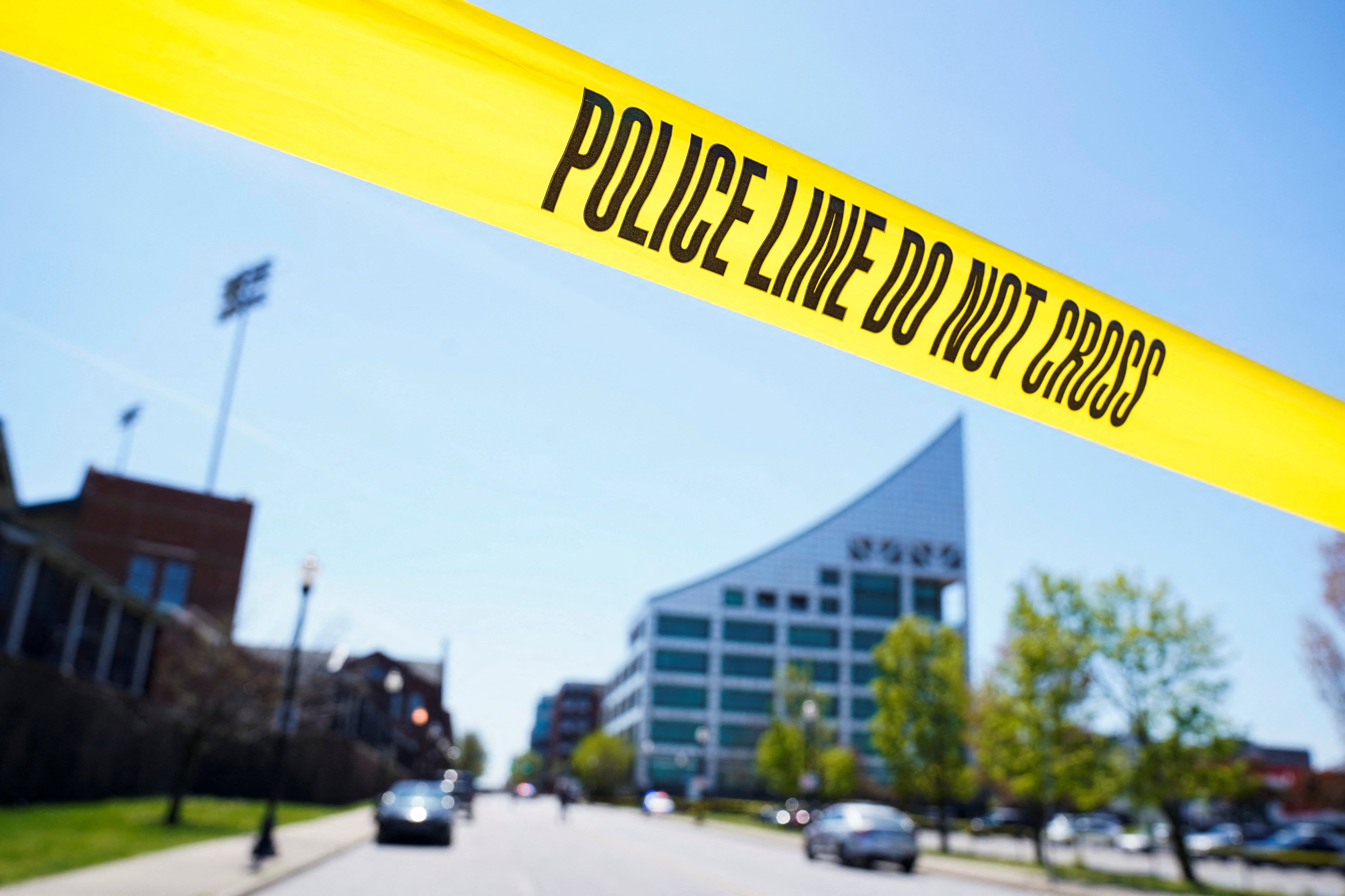 View of barricade tape as police deploy at the scene of a mass shooting near Slugger Field baseball stadium in downtown Louisville