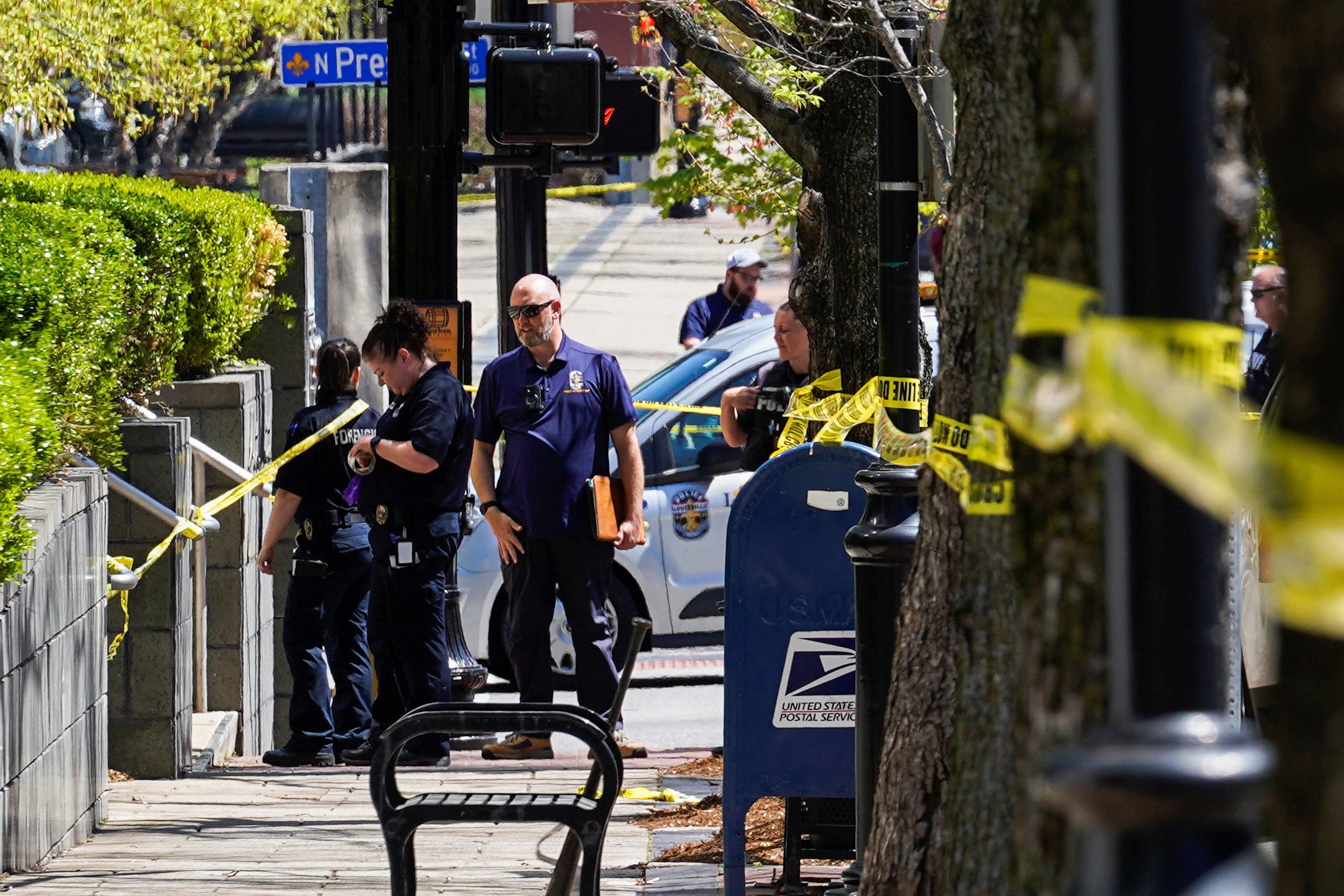 Police deploy at the scene of the mass shooting in downtown Louisville