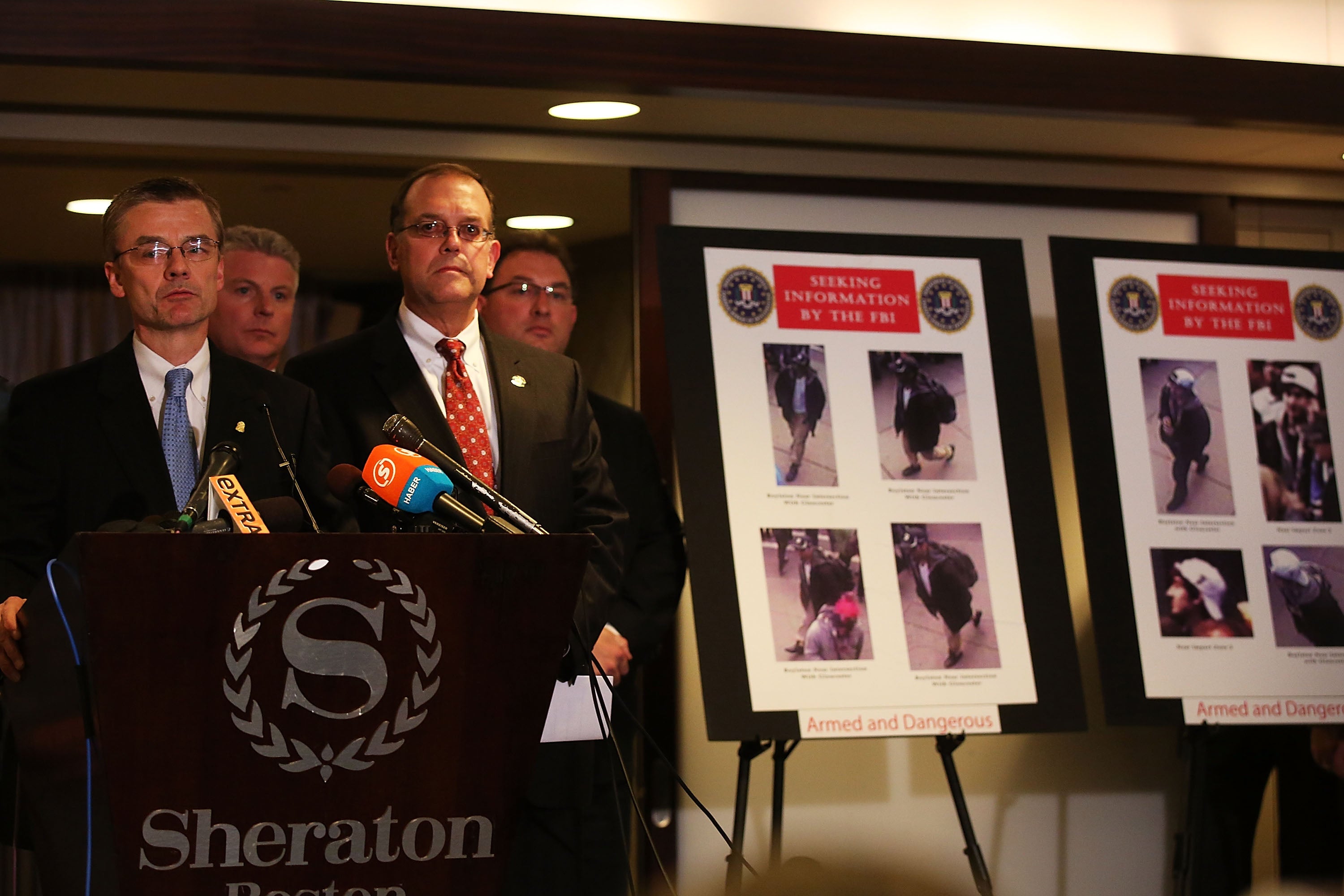 FBI Special Agent Richard Deslauriers and other investigators release images taken from a security camera of persons of interest in the Boston Marathon bombings during a news conference on 18 April 2013 in Boston, Massachusetts