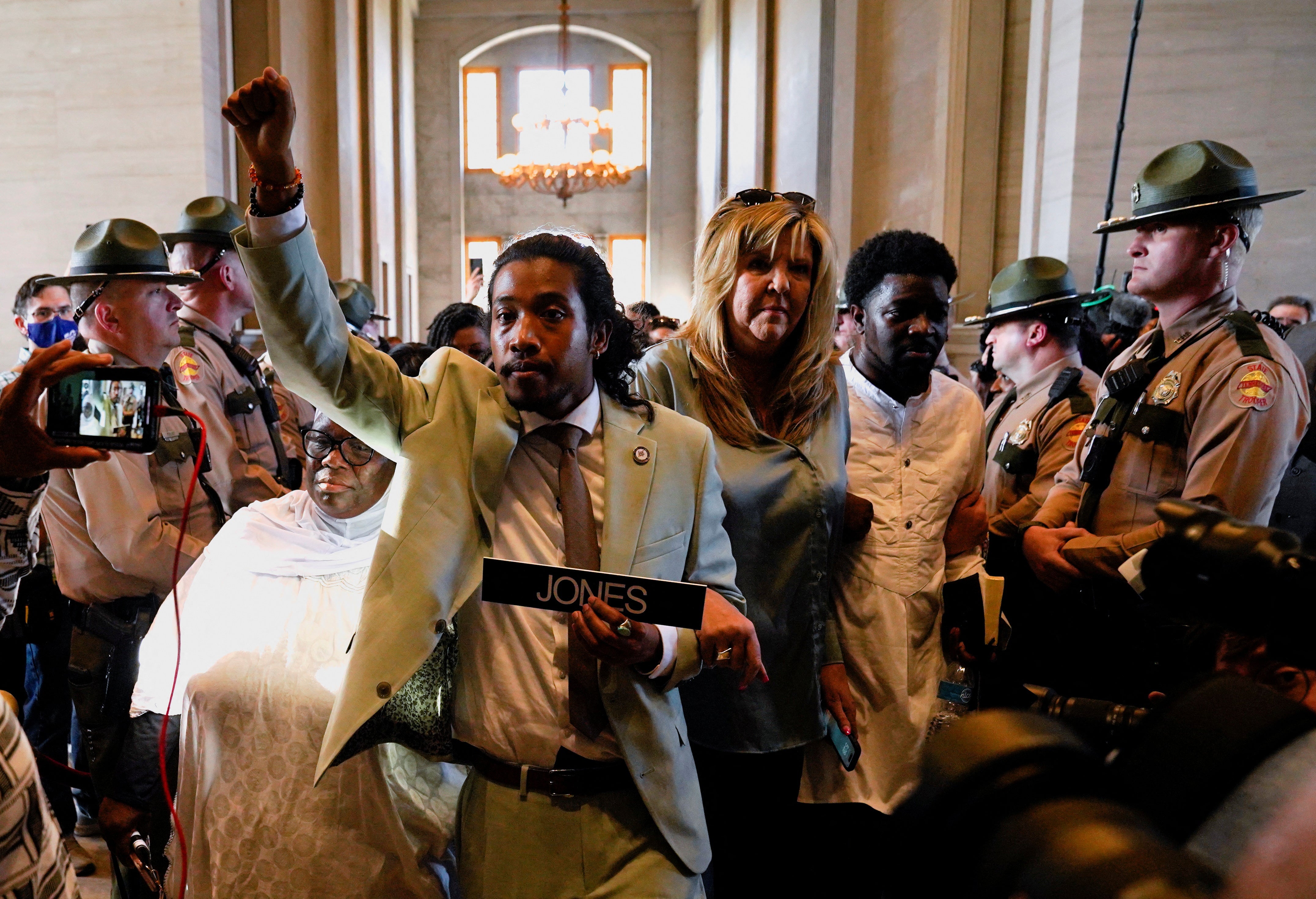 Representative Justin Jones reenters the House Chamber after being reinstated days after the Republican majority Tennessee House of Representatives voted to expel two Democratic members, representatives Justin Pearson and him, for their roles in a gun control demonstration on the statehouse floor