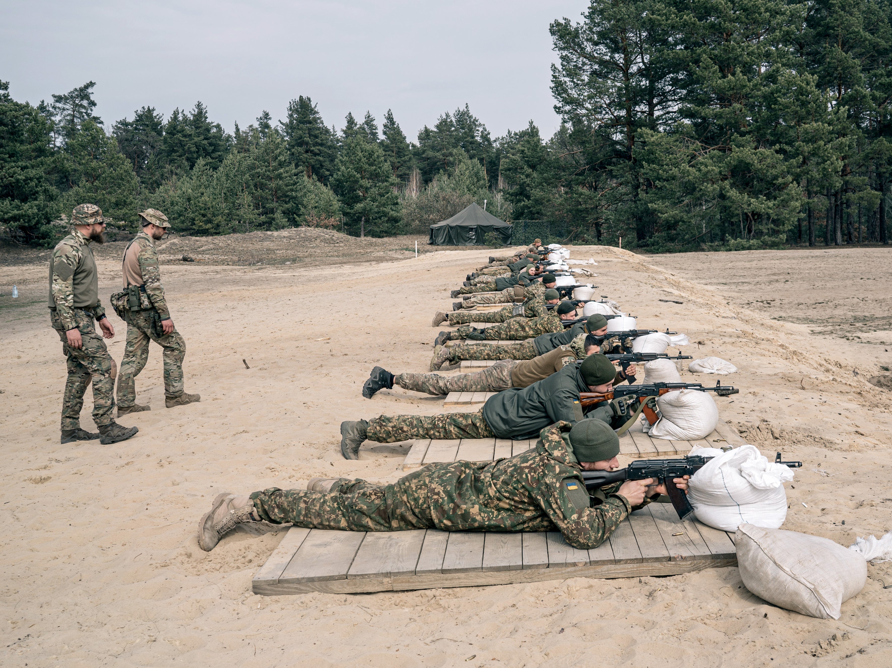 Recruits attend shooting practice at an Azov Brigade training camp outside Kyiv