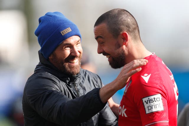 <p>Ryan Reynolds celebrates with Wrexham’s Ollie Palmer</p>