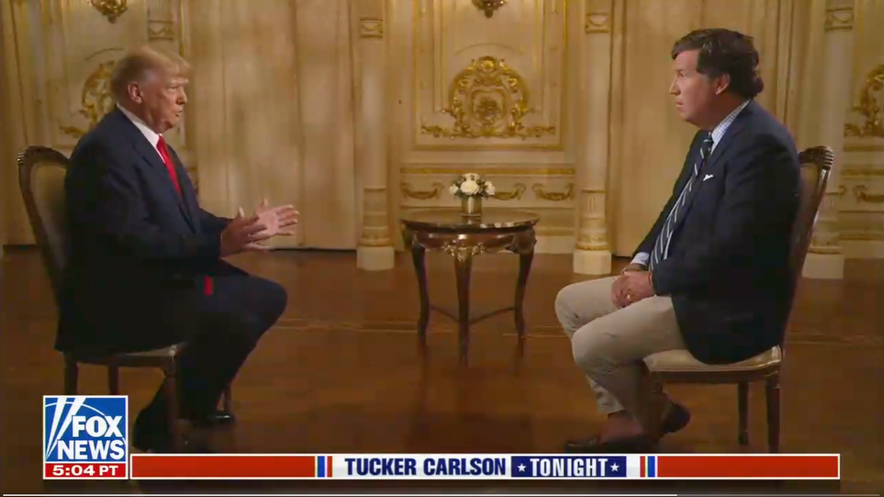 Donald Trump speaks to Tucker Carlson in an interview for Fox News