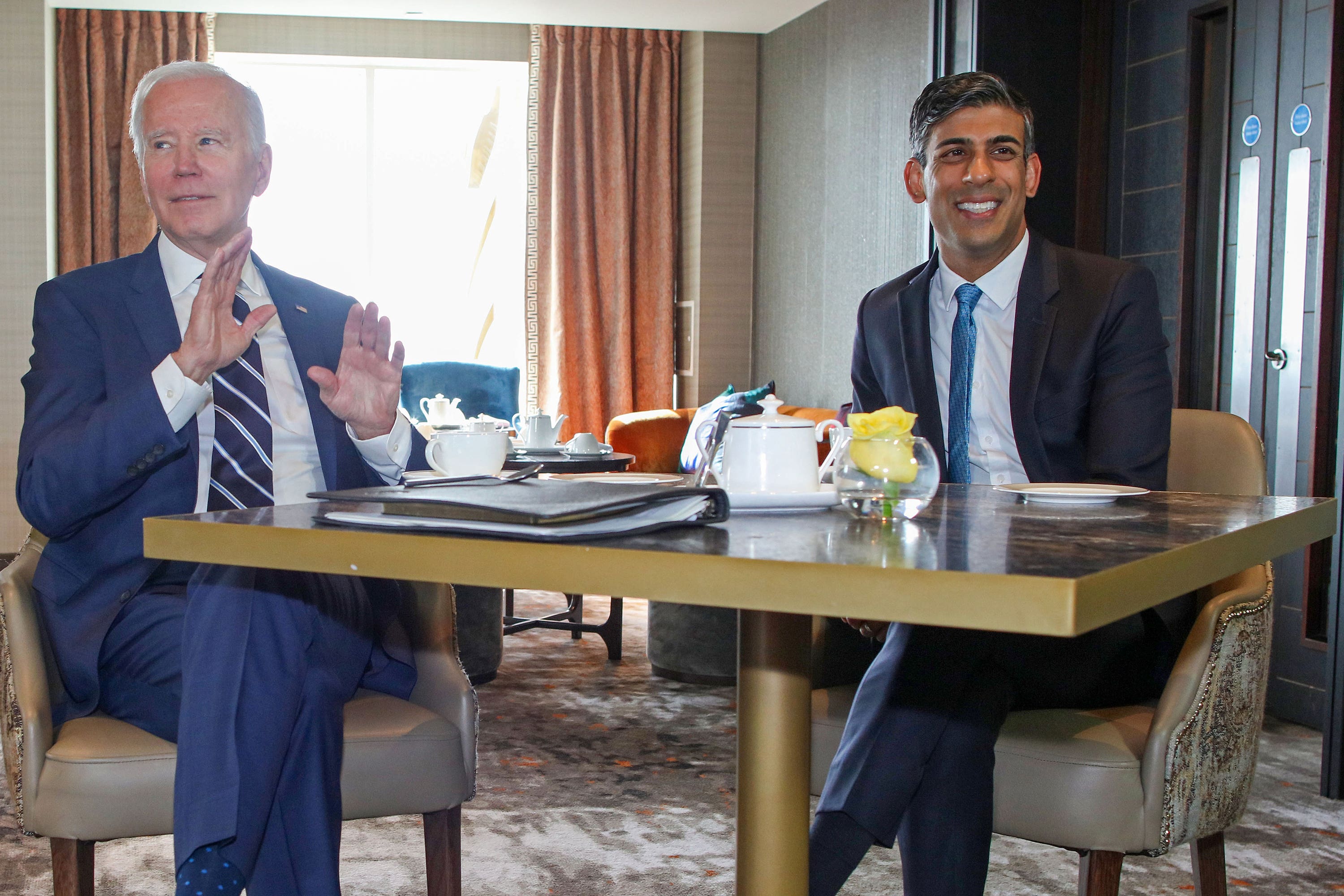 Prime Minister Rishi Sunak with US President Joe Biden at the Grand Central Hotel in Belfast (Paul Faith/PA)