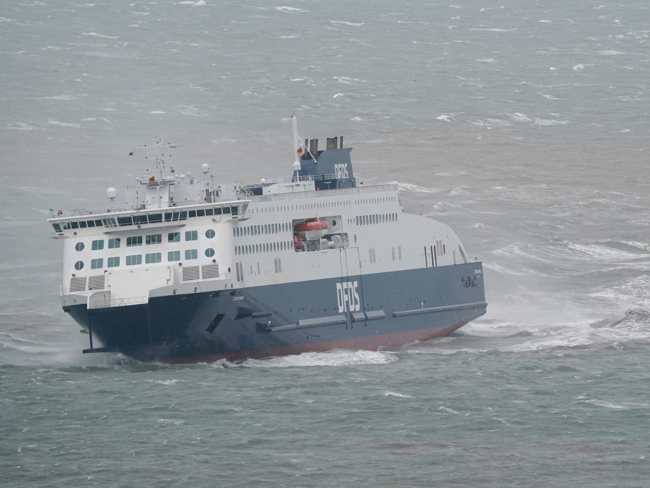 A ferry coming into Dover is buffeted by strong winds