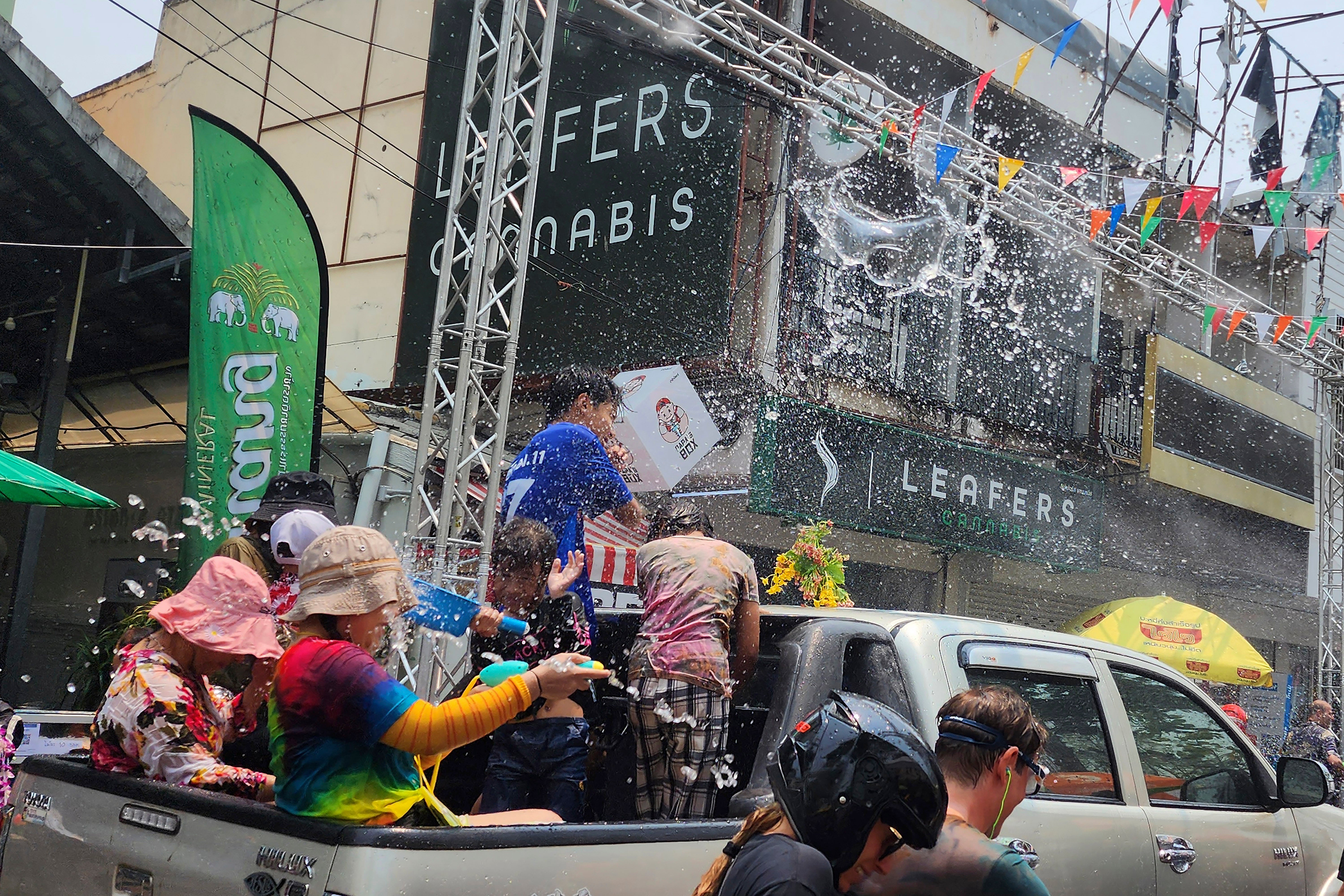 Thai people splash water to celebrate Songkran festival in Chiang Mai province, northern Thailand