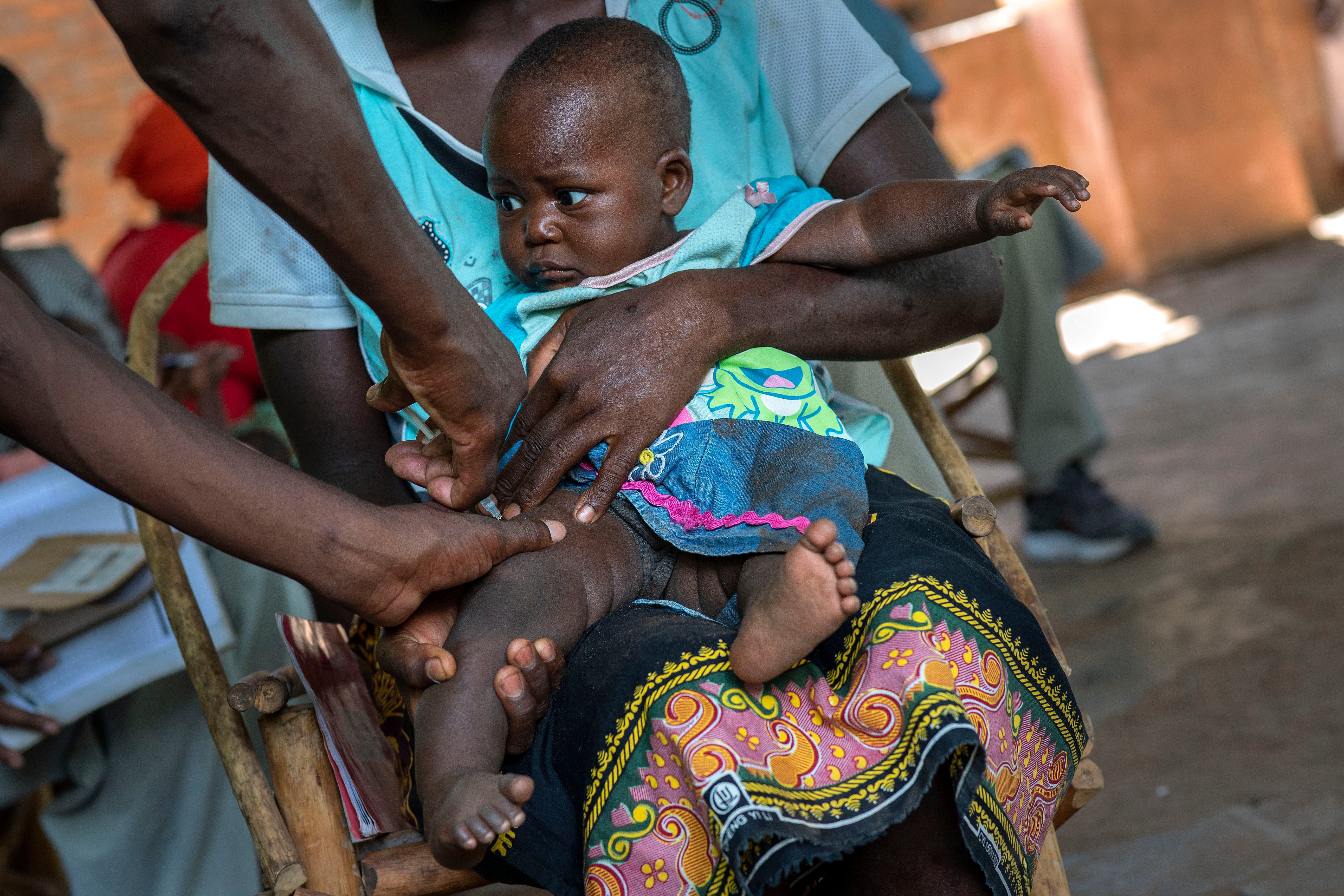 A baby is given another malaria vaccine in Malawi in 2019