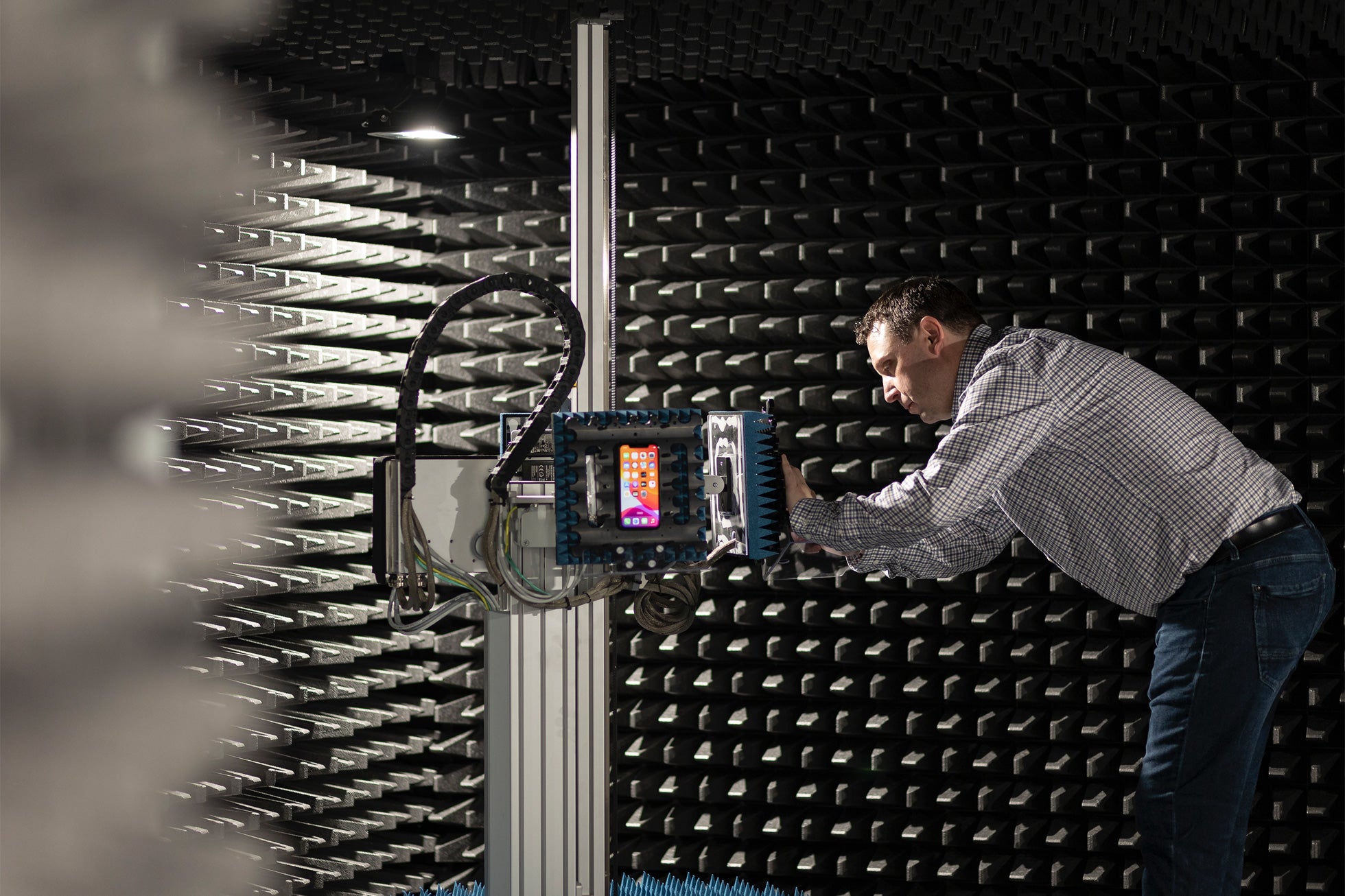 The room in Apple’s Munich lab used for testing the phones’ cellular connections. Devices can be placed in the arms and moved around – nearer and further from the cellular base stations at the other side of the room – to simulate real life use.