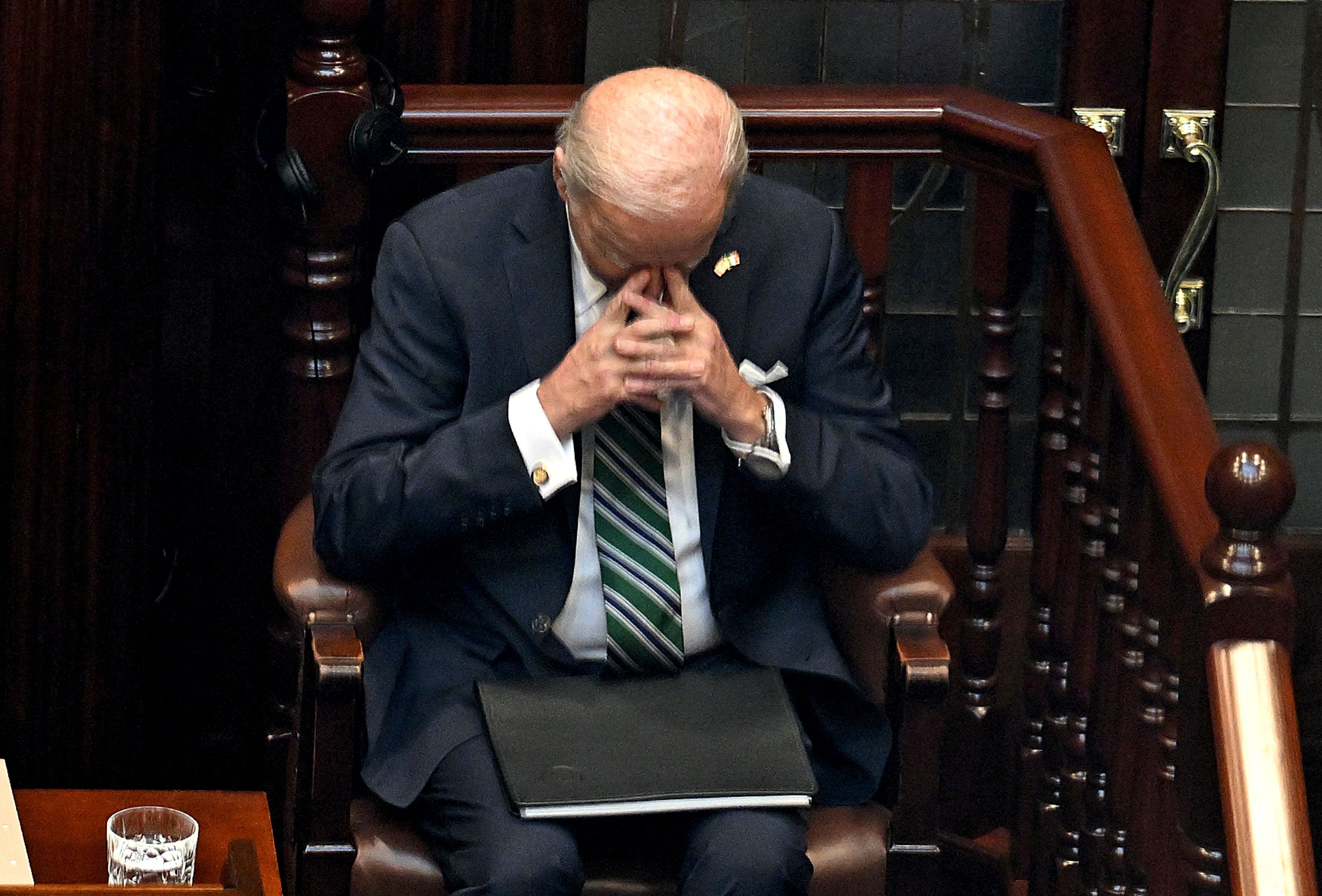 Biden prays after delivering his speech to the Dail