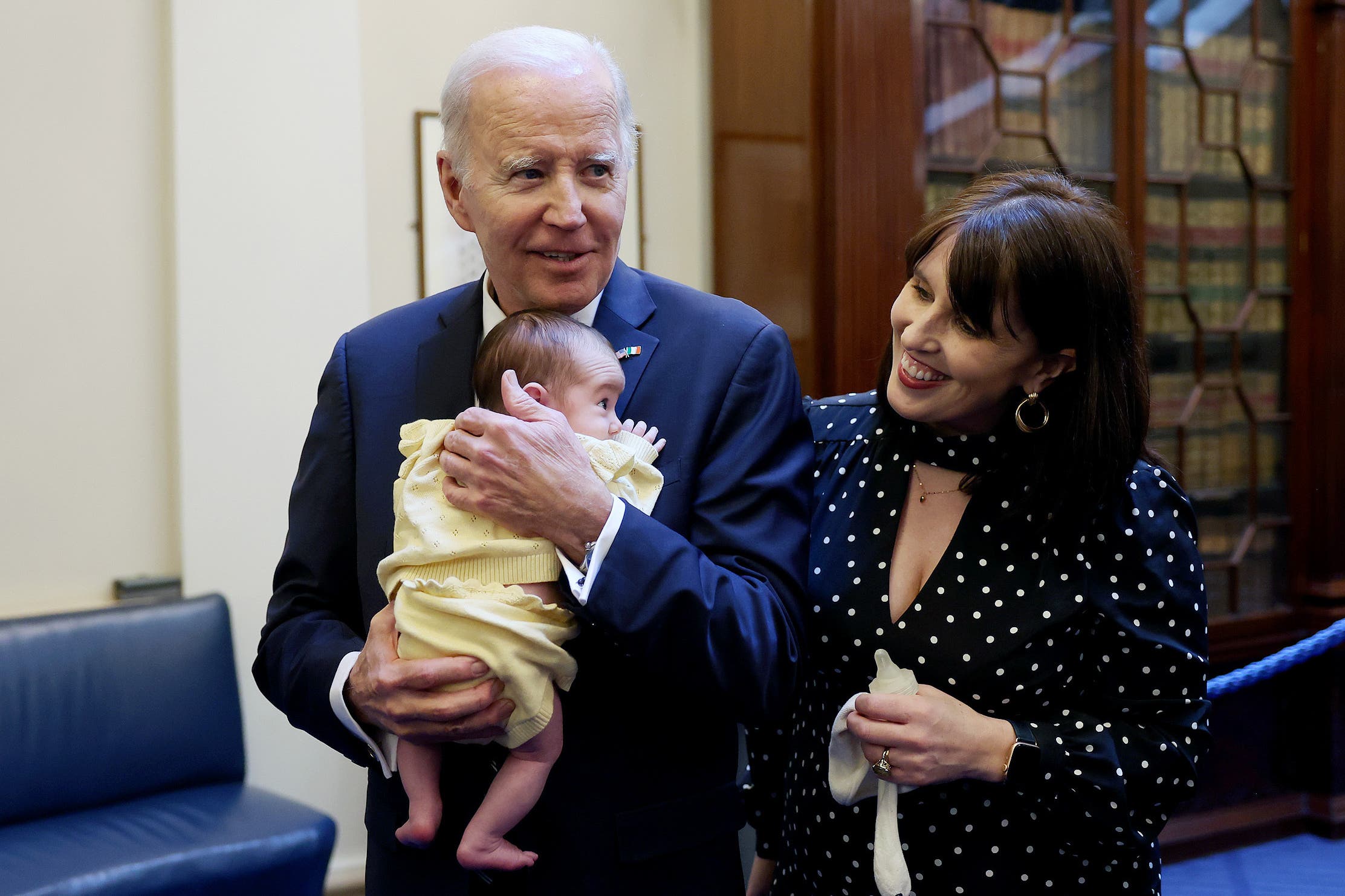 Handout photo issued by the Government of Ireland of US President Joe Biden with Senator Rebecca Moynihan and her daughter Margot at Leinster House in Dublin, on day three of his visit to the island of Ireland (Tony Maxwell/PA)