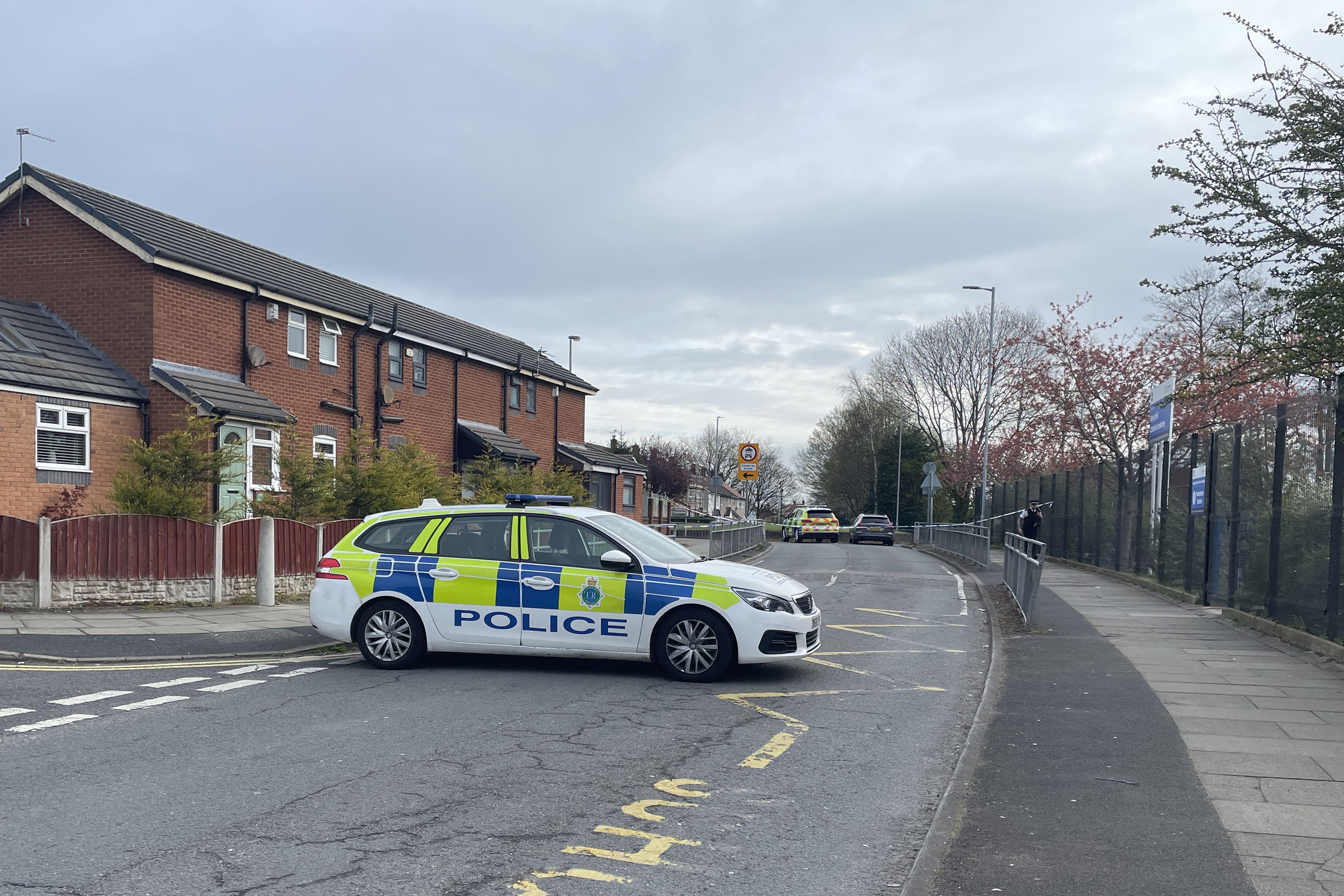 Police at the scene in Netherton, Merseyside, after a man was hit by a suspected stolen car (Eleanor Barlow/PA)