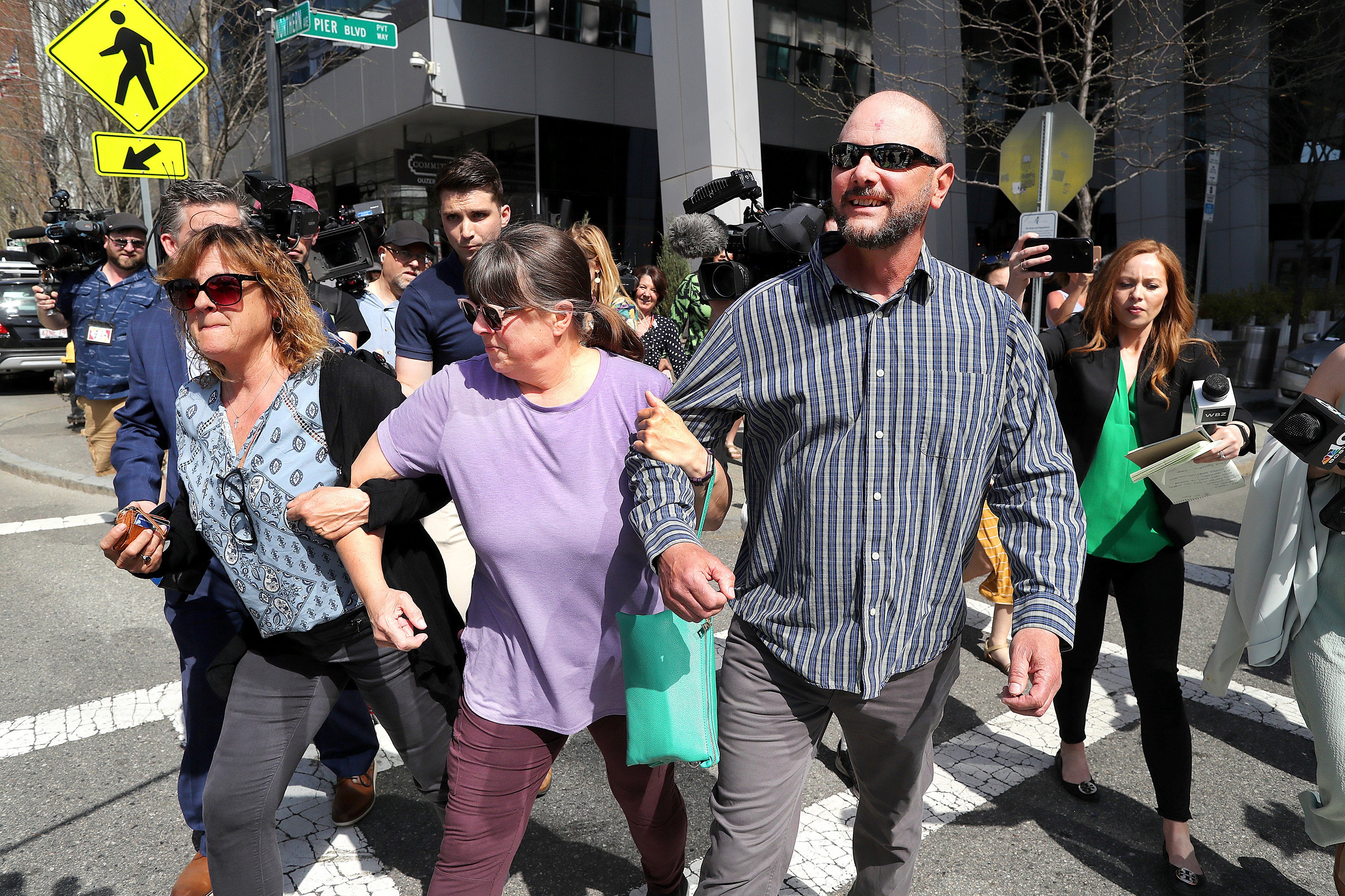 Teixeira’s family members leave the Moakley Federal Courthouse after his court appearance in Boston.