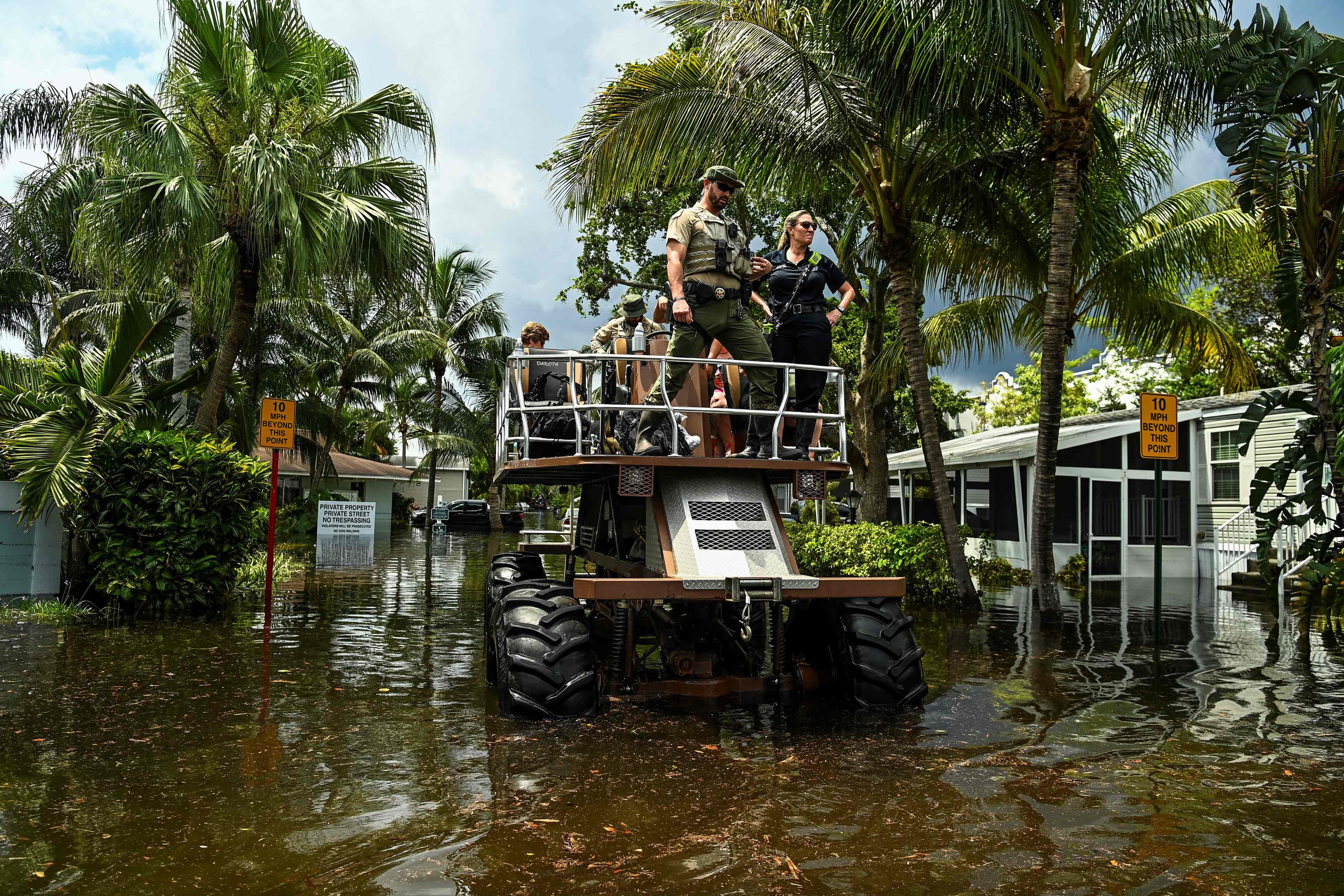 eople get rescued by Florida Fish and Wildlife Conservation law enforcement from a flooded neighborhood after heavy rain in Fort Lauderdale, Florida, on April 13